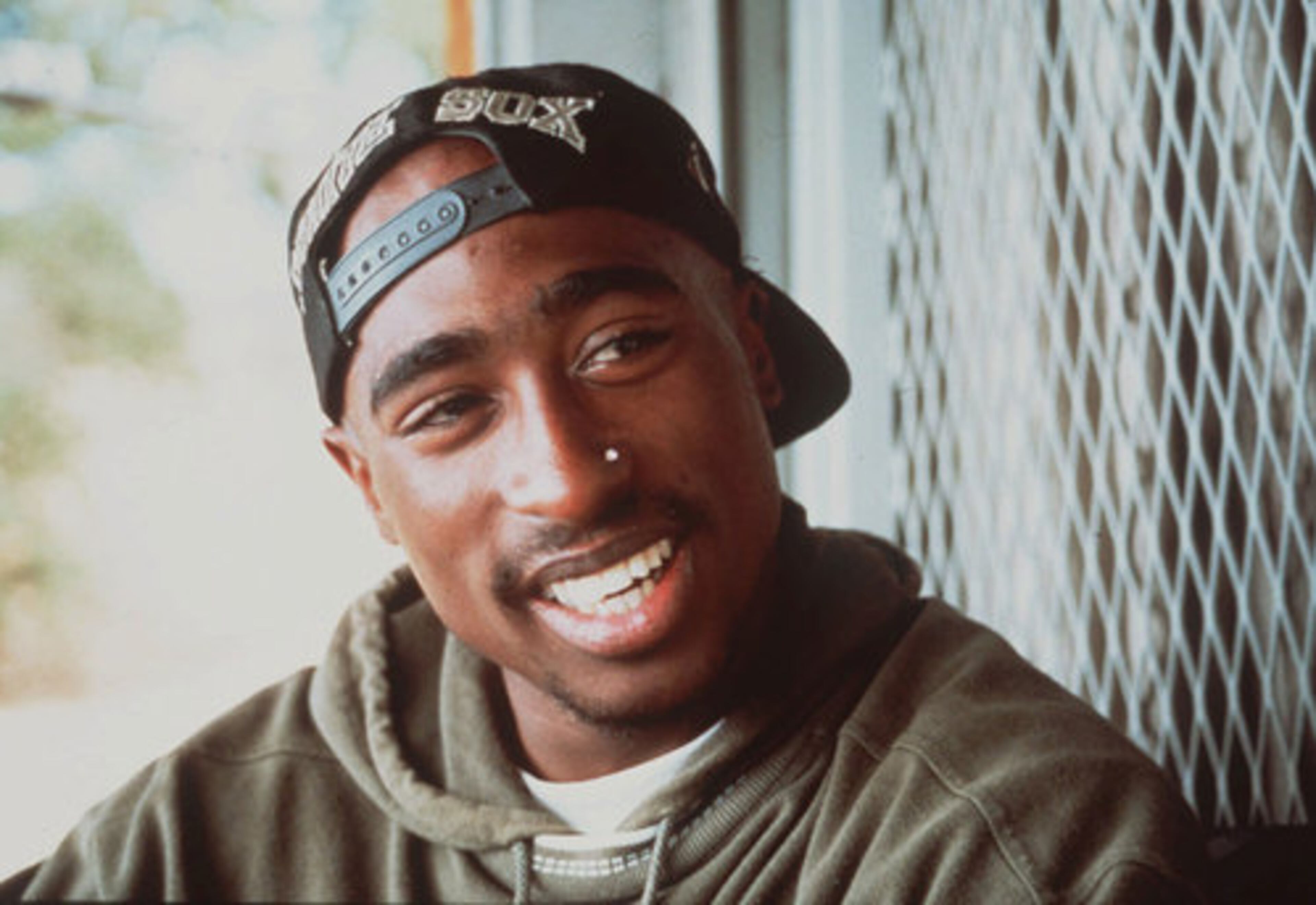 TUPAC'S LEGACY LIVES ON: Tupac Shakur, photographed in 1993. New York City police have begun an investigation into an online posting supposedly from a convicted felon who claims to have shot and robbed slain rapper Tupac Shakur. A group of diverse artists came together Thursday in Atlanta to play a benefit concert on what would have been rapper Tupac Shakur's 40th birthday.