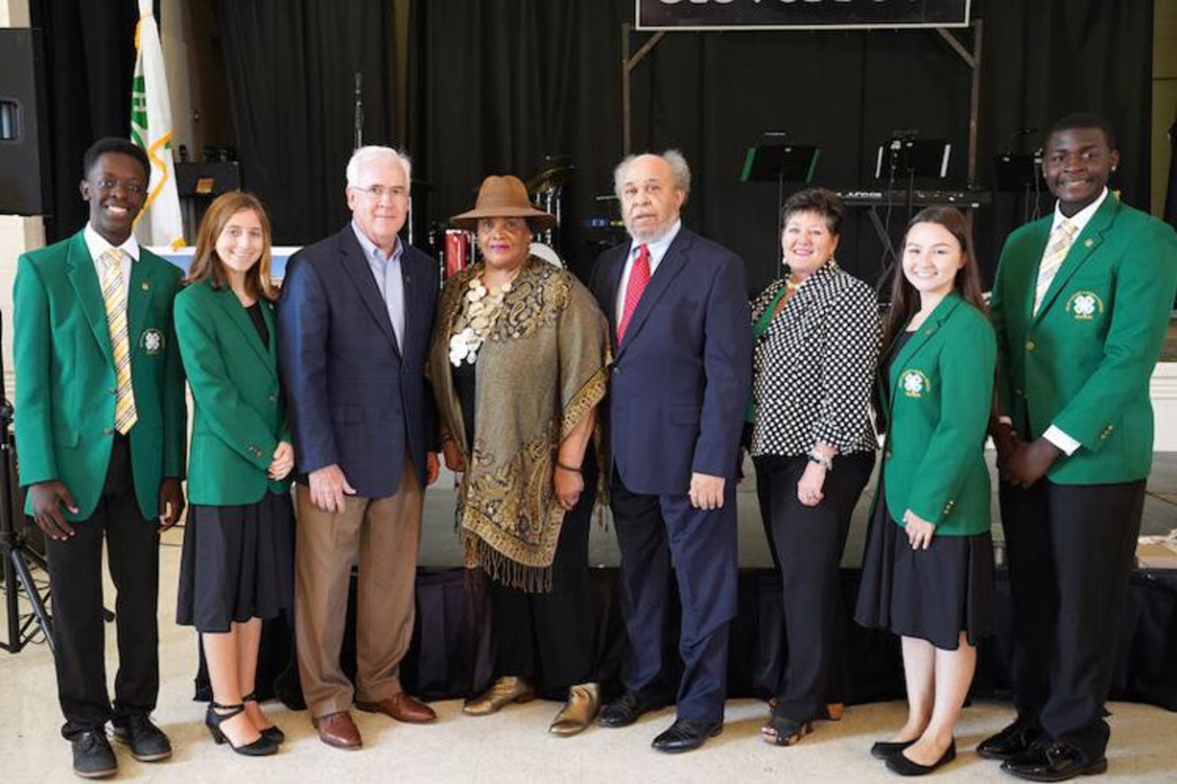 From left, Georgia 4-H State Officer Willie White, Georgia 4-H State President Katie Beth Brewer, Georgia 4-H Director Arch Smith, retired UGA Extension Agent Dorothy Graves, retired Director of Extension and Dean Emeritus for FVSU Fred Harrison, Associate Dean for UGA Extension Laura Perry Johnson, State Officer Hinano Tomlinson and State Officer Jay Lovett gather during a recognition ceremony at Emery Thomas Auditorium. (Courtesy of UGA/CAES)