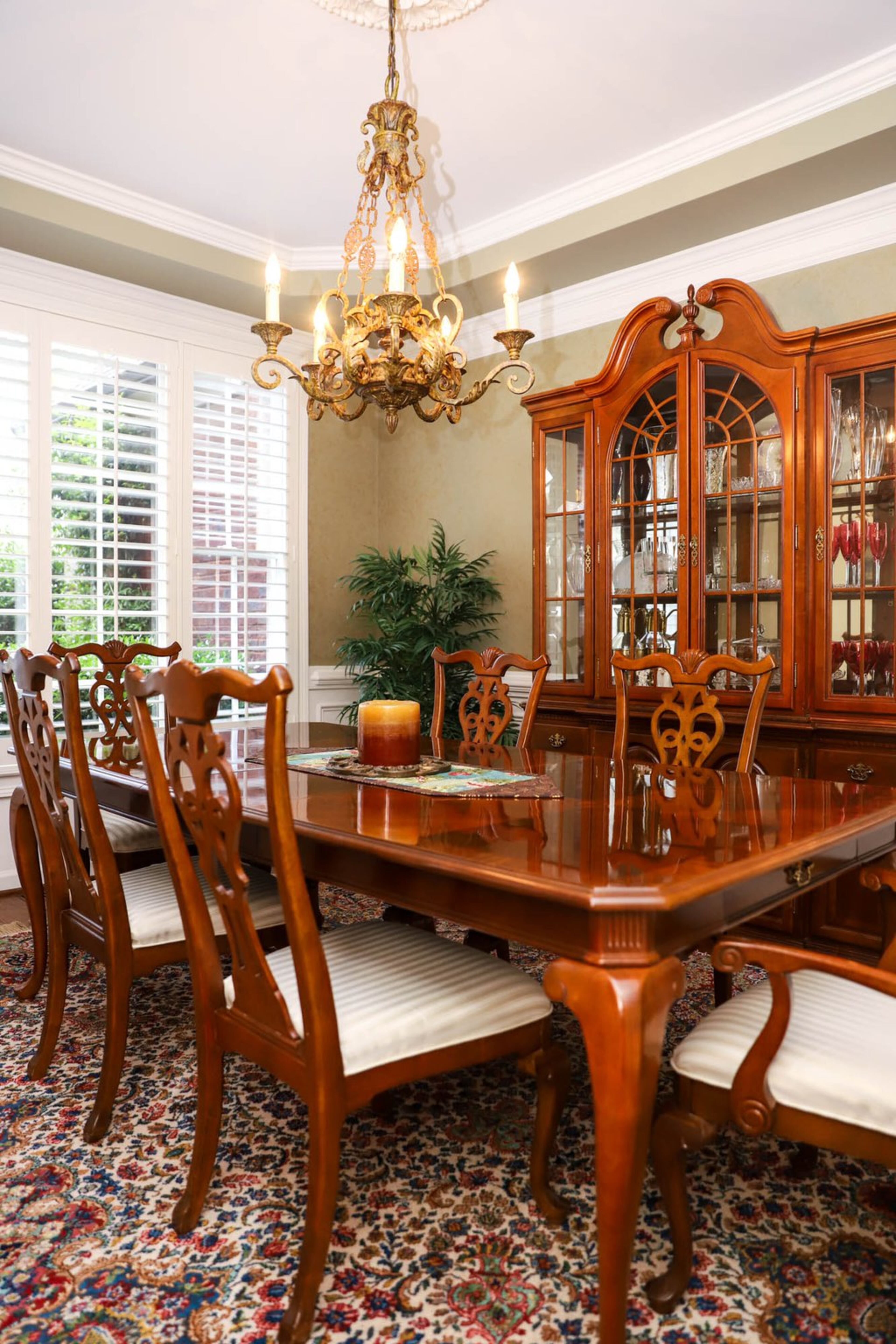 A traditional wooden dining table, chairs and china cabinet from Freed’s Furniture in Dallas, Texas, set the tone for Tina and Mark Bliese’s dining room. The ornate chandelier that hangs overhead fits the traditional decor in the space, and luckily, it was already in place when the couple purchased their home in 2010. Text by Shannon Dominy. Photo by Reynolds Rogers.
