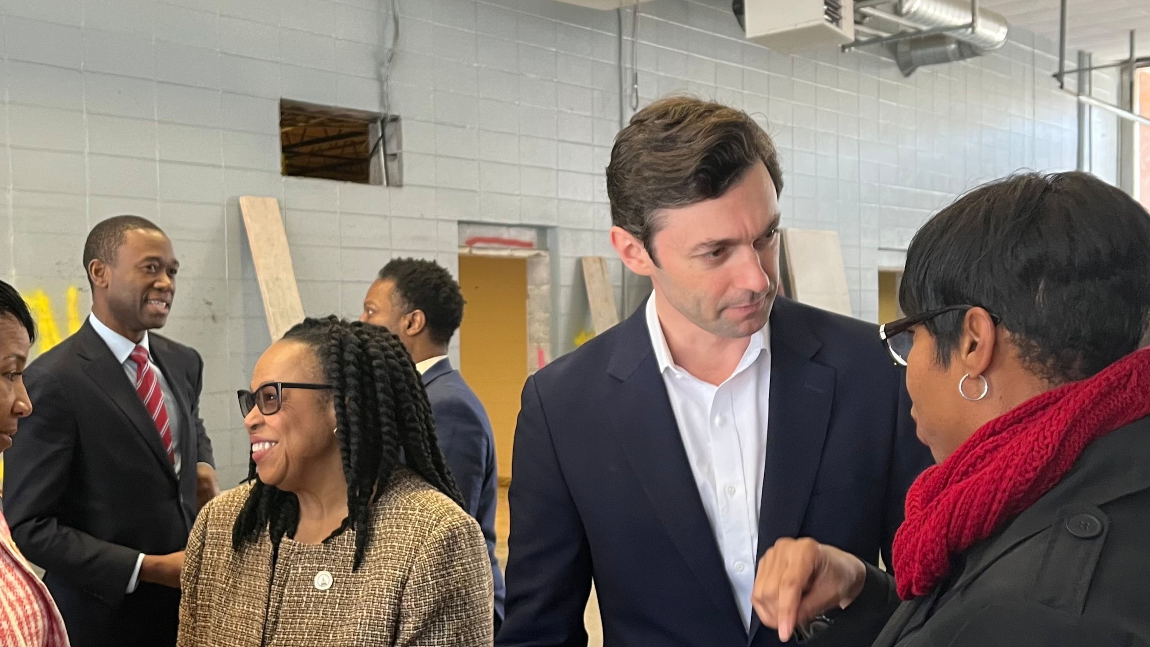 U.S. Sen. Jon Ossoff and U.S. Deputy Secretary of the Treasury Wally Adeyemo meet with Cobb County officials on Thursday, Feb. 15, 2024, at the site of the new workforce development center coming to Mableton. (Taylor Croft/taylor.croft@ajc.com)