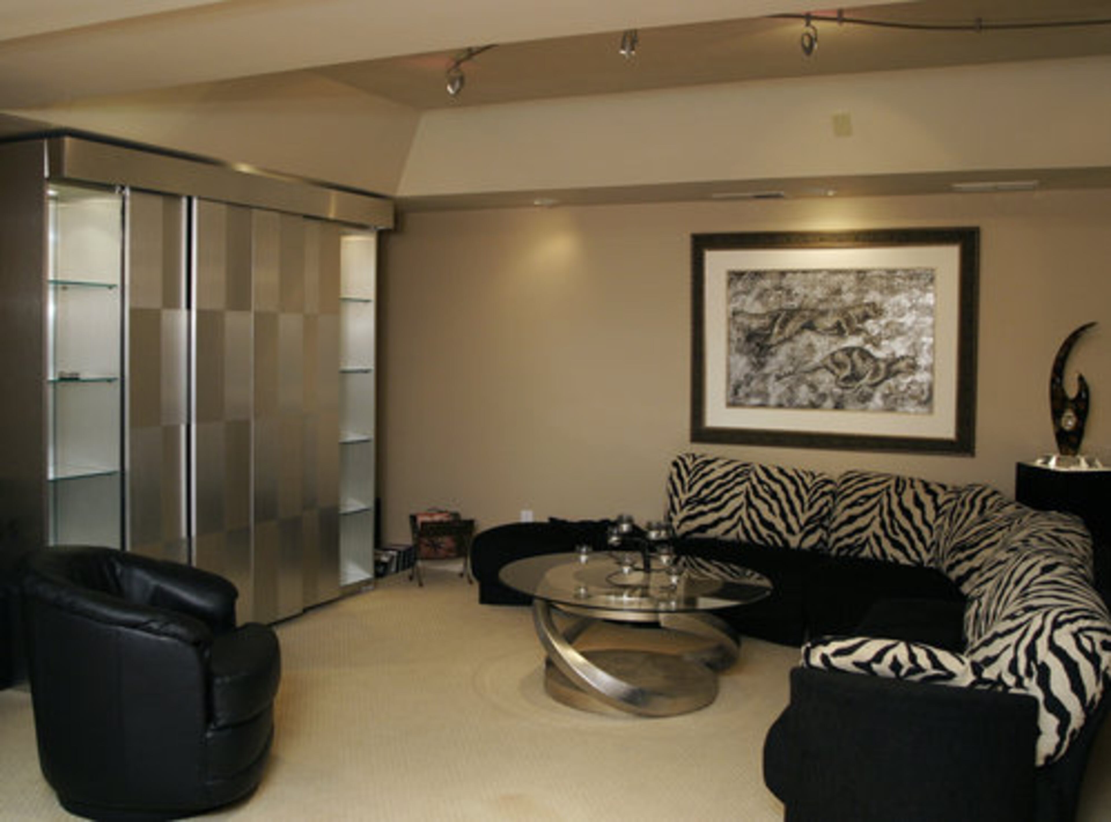 The family enjoys a regular movie night in the basement area. They sit down with their home movies and popcorn and take a trip down memory lane. The basement also boasts a mini kitchen.