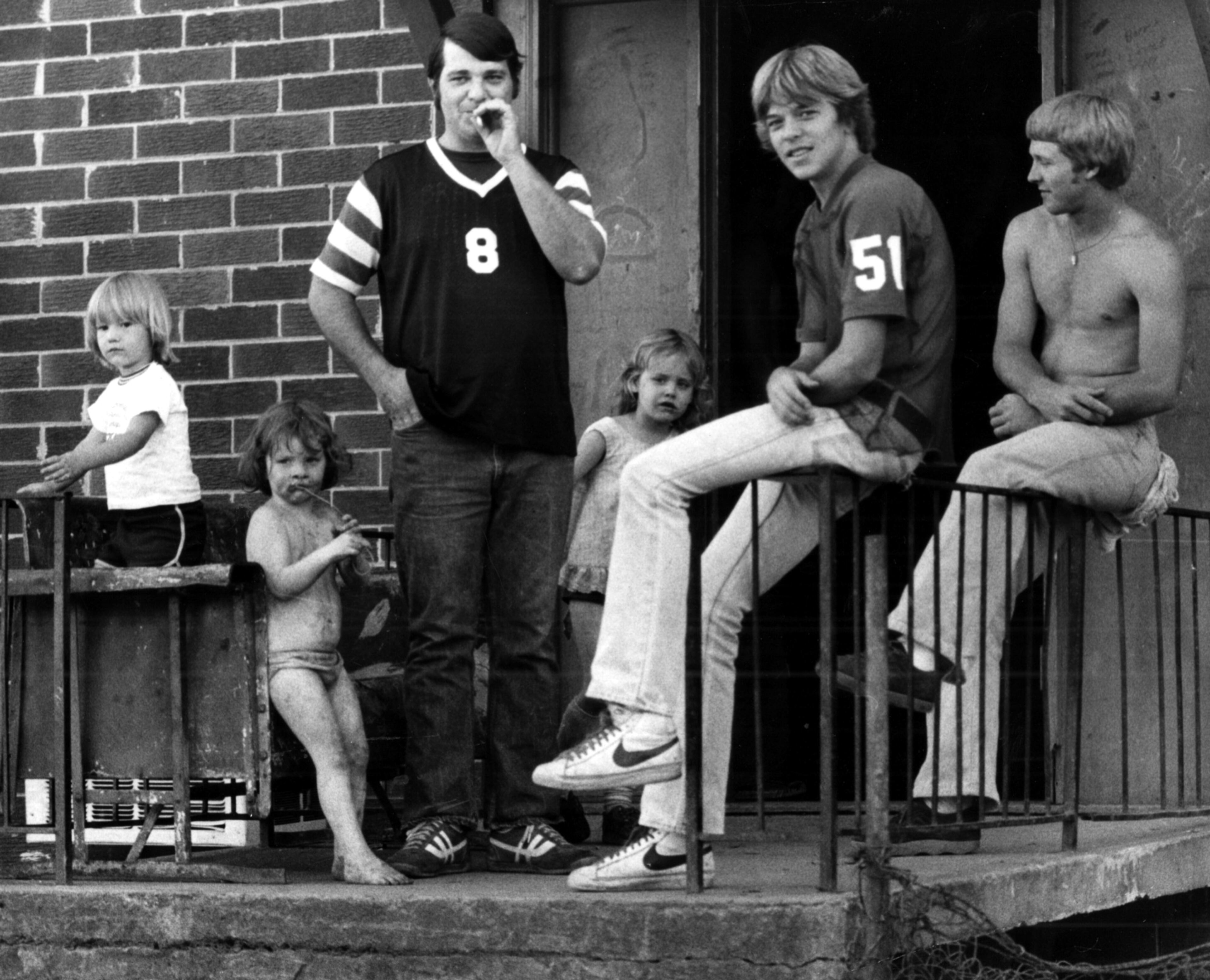 Cabbagetown residents stand in front of a run down apartment building on May 21, 1979.