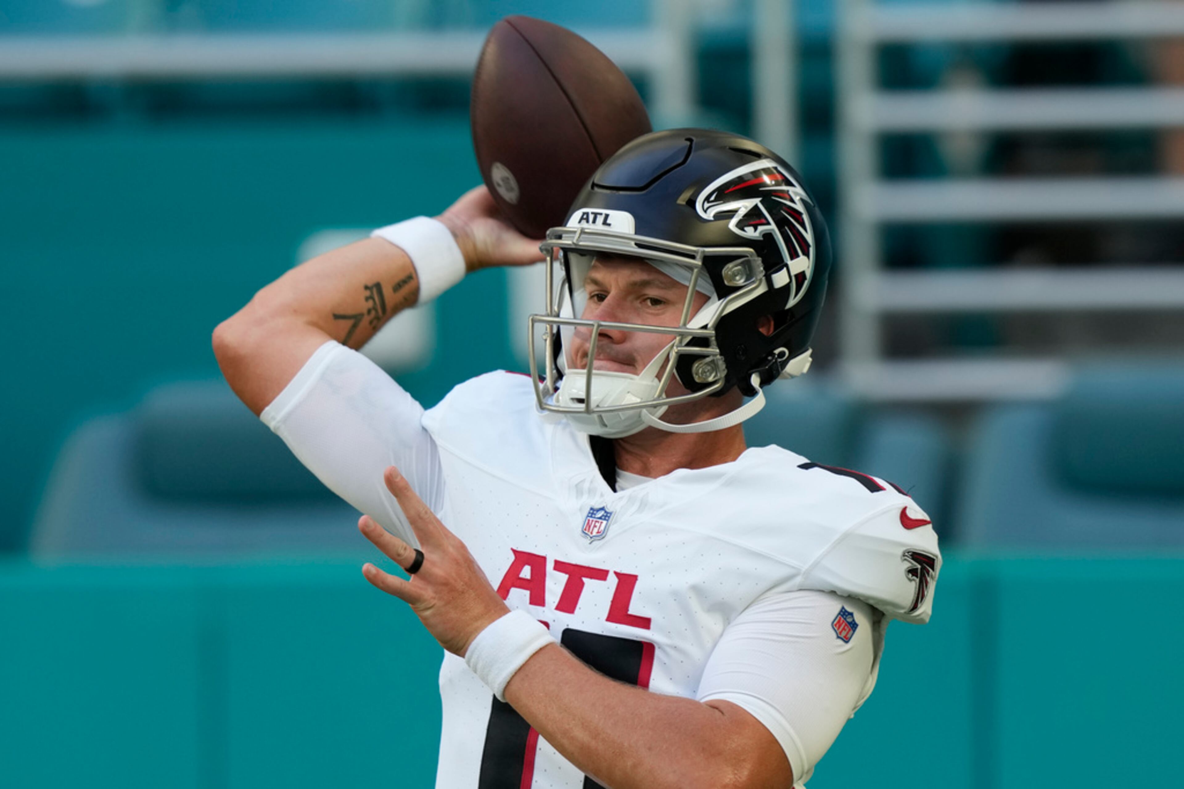 Atlanta Falcons quarterback Logan Woodside (11) warms up before a preseason an NFL football game against the Miami Dolphins, Friday, Aug. 11, 2023, in Miami Gardens, Fla. (AP Photo/Marta Lavandier)