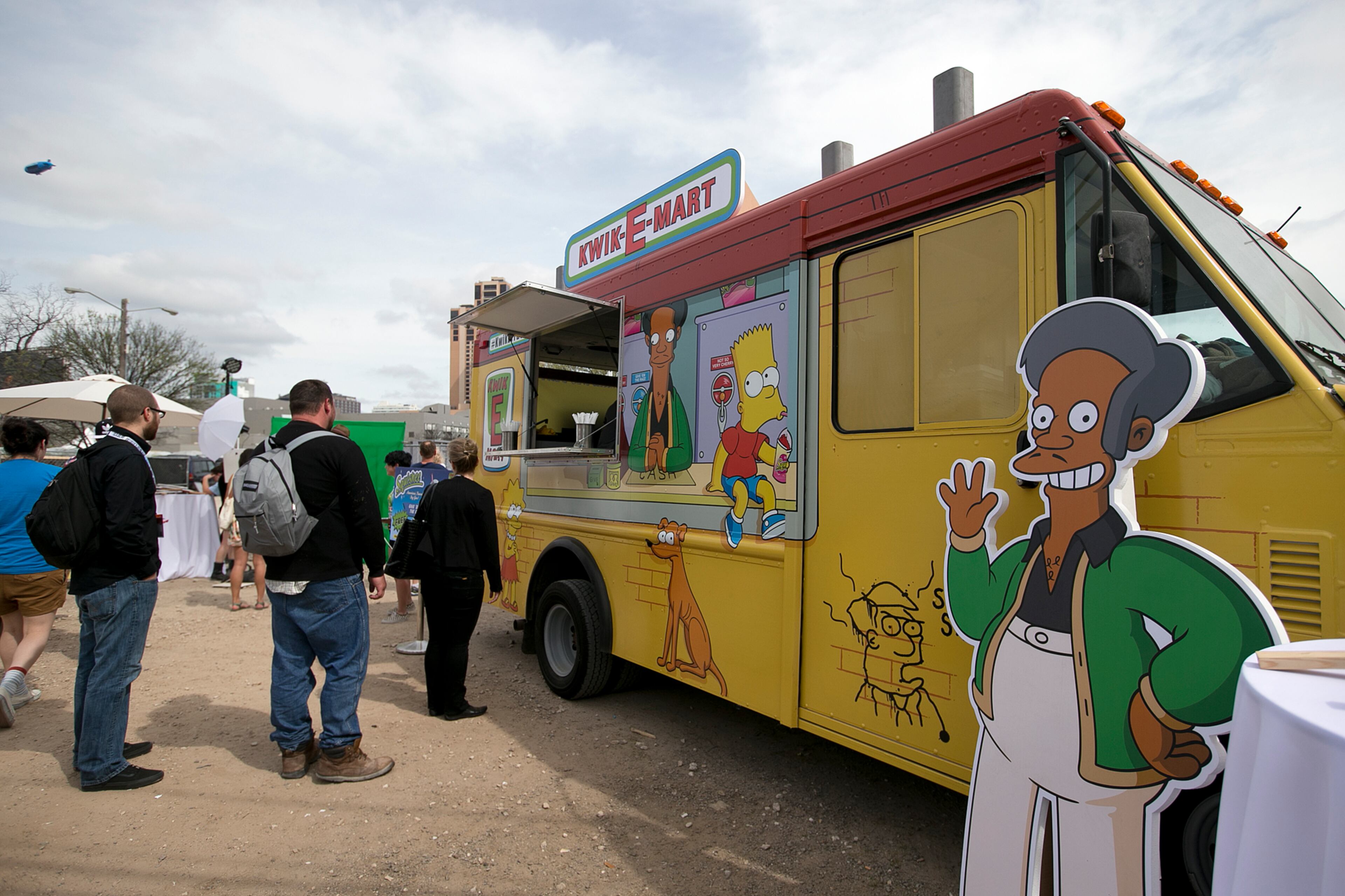 People line up for free squishees at the Simpsons Kwik-E-Mart Truck at South Bites Food during SXSW at the Austin Convention Center on Sunday, March 15, 2015. DEBORAH CANNON / AMERICAN-STATESMAN
