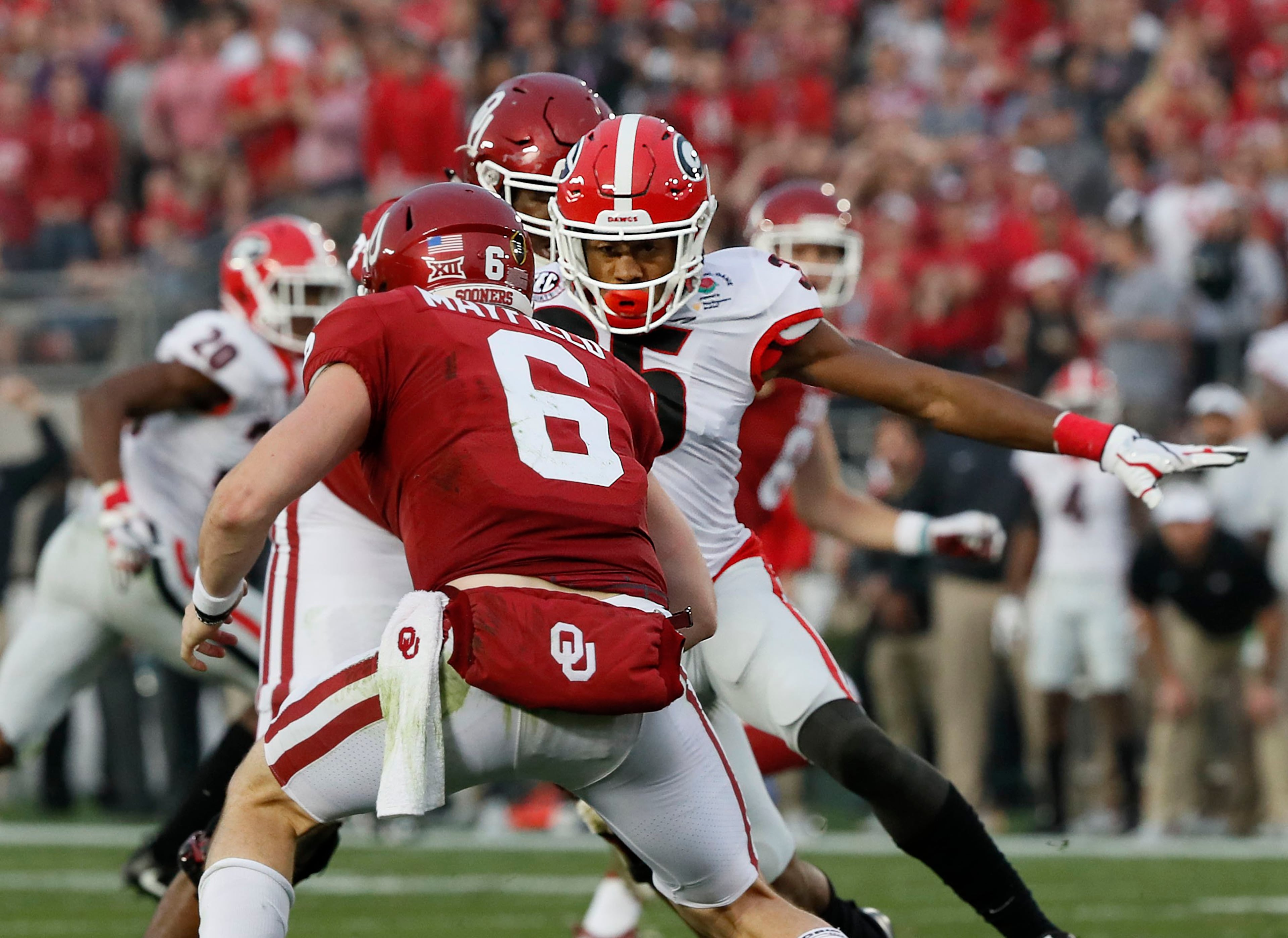 1/1/18 - Pasadena - Georgia Bulldogs defensive back Aaron Davis (35) on a sack of Oklahoma Sooners quarterback Baker Mayfield (6) in the second half of the College Football Playoff Semifinal at the Rose Bowl Game on Monday, January 1, 2018, in Pasadena. BOB ANDRES /BANDRES@AJC.COM