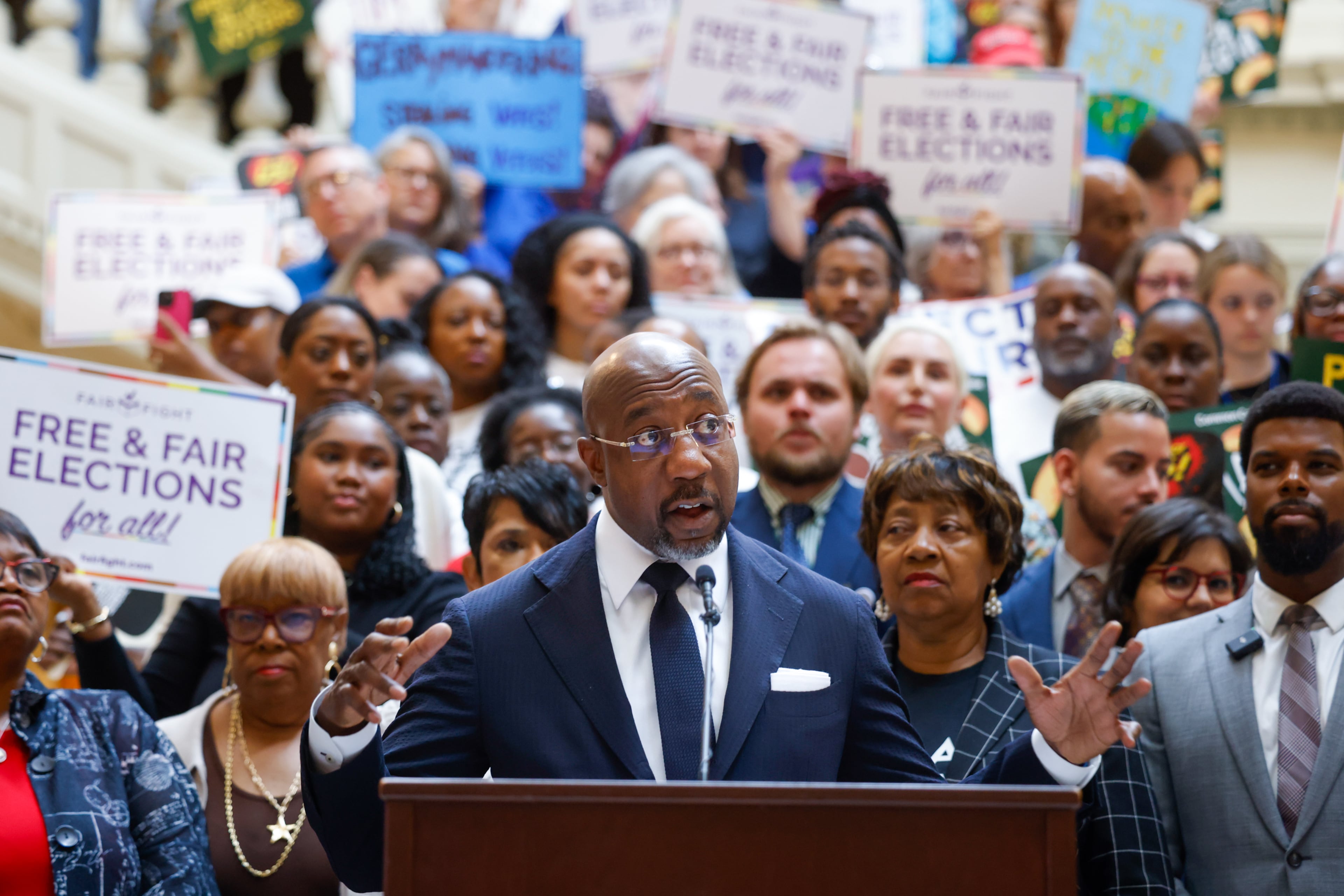 Democratic U.S. Sen. Raphael Warnock speaks at a press conference before the state legislature convenes for a special session in Atlanta on June 17, 2026. (Arvin Temkar/AJC)