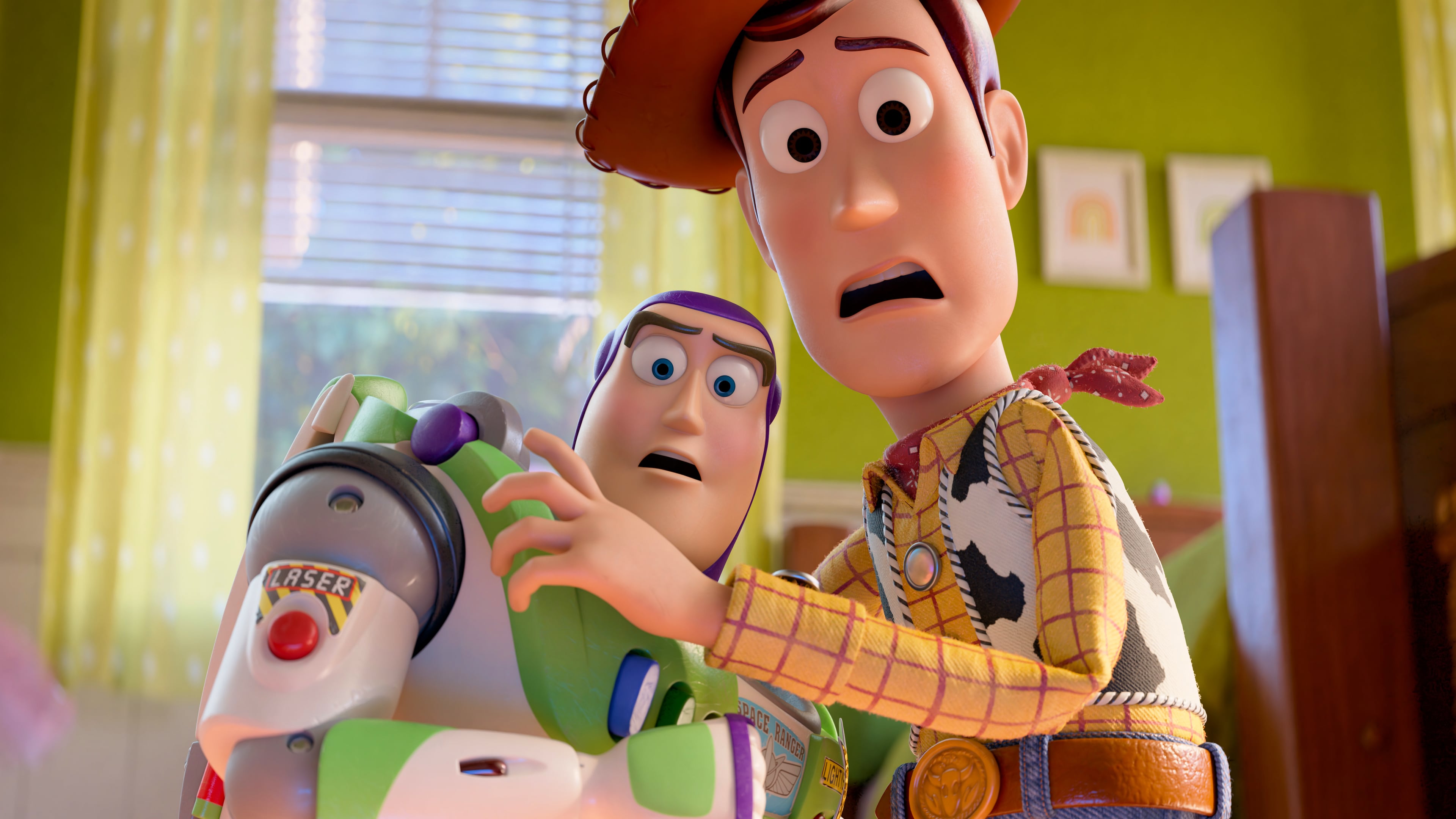 This image released by Disney shows characters Buzz Lightyear, voiced by Tim Allen, left, and Woody, voiced by Tom Hanks, in a scene from "Toy Story 5." (Pixar-Disney via AP)