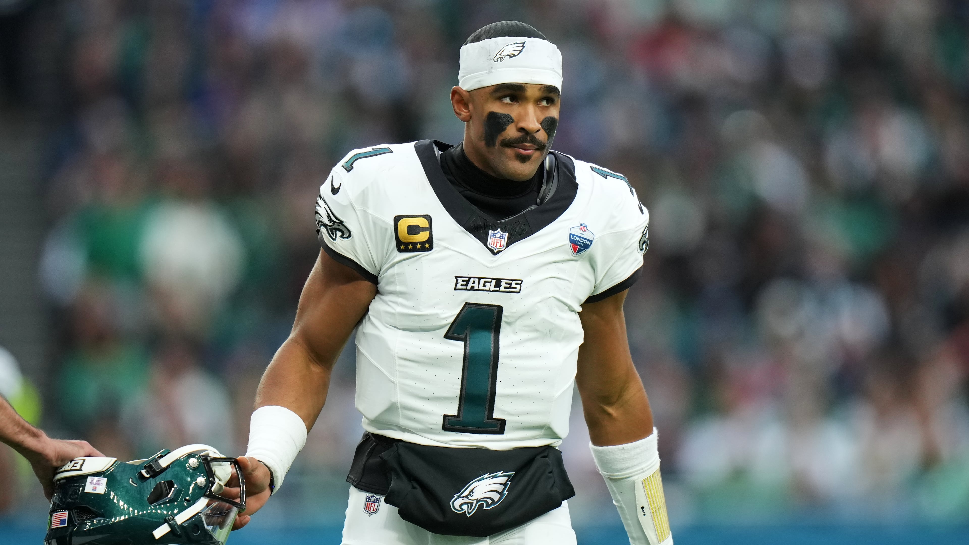 Philadelphia Eagles quarterback Jalen Hurts (1) stands on the field during an NFL football game against Jacksonville Jaguars in London, Sunday, Oct. 11, 2026. (AP Photo/Alastair Grant)