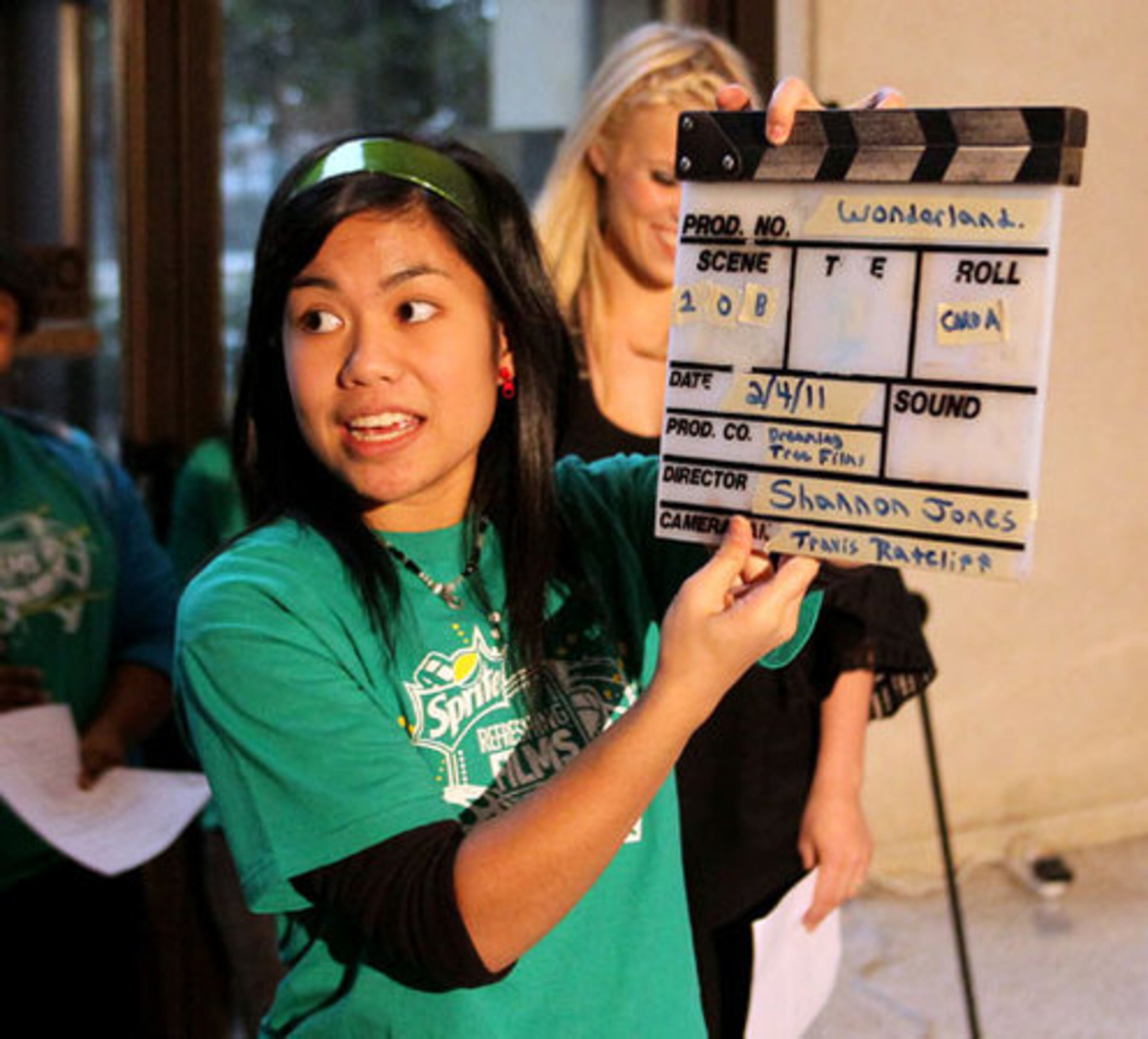 Atlantan Carla Javier holds a slate up during filming.