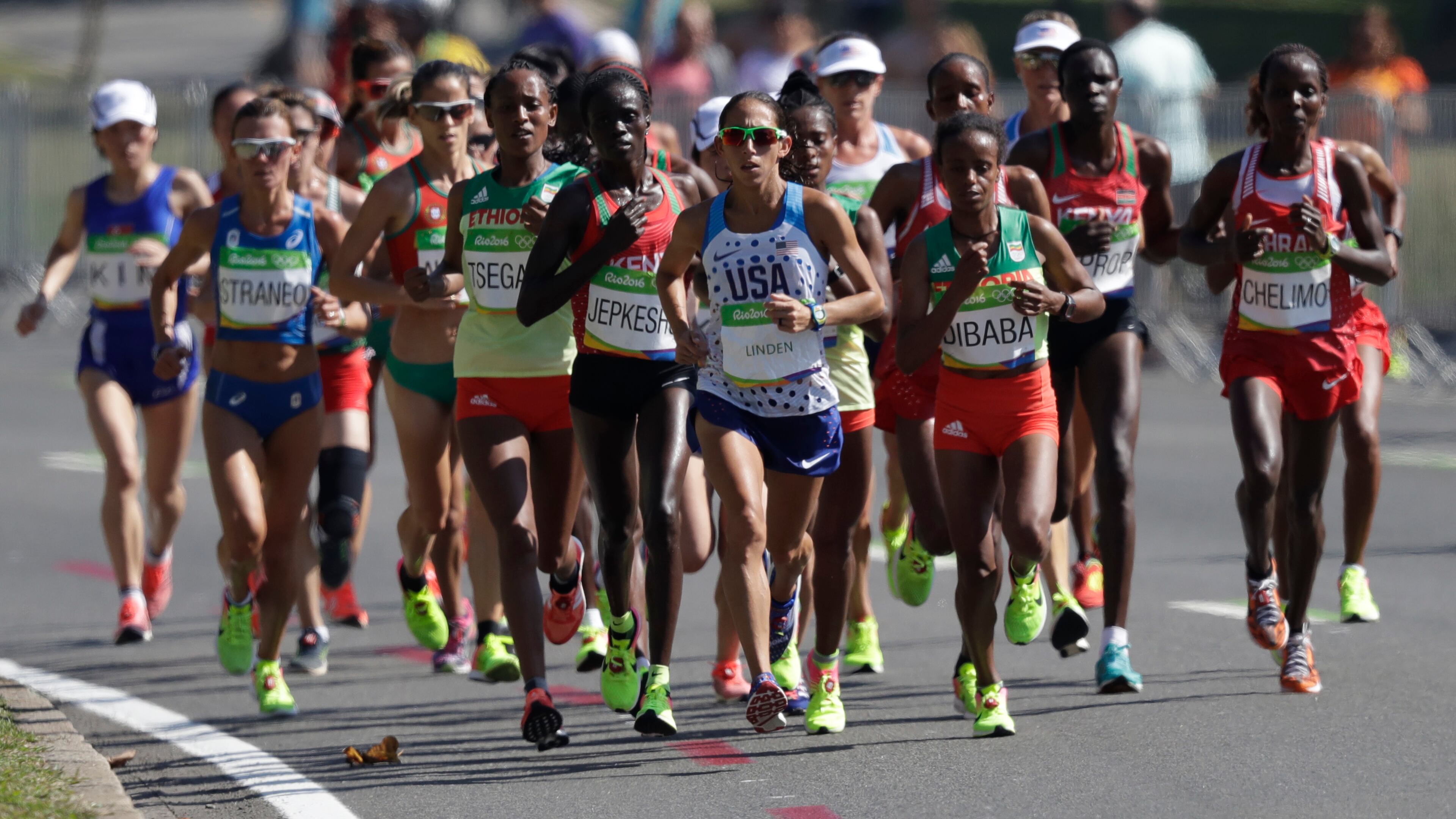 Athletes compete in the women's marathon during the Summer Olympics athletics event in Rio de Janeiro, Brazil, Sunday, Aug. 14, 2016. At front center is Desiree Linden, of the United States. (AP Photo/Robert F. Bukaty)
