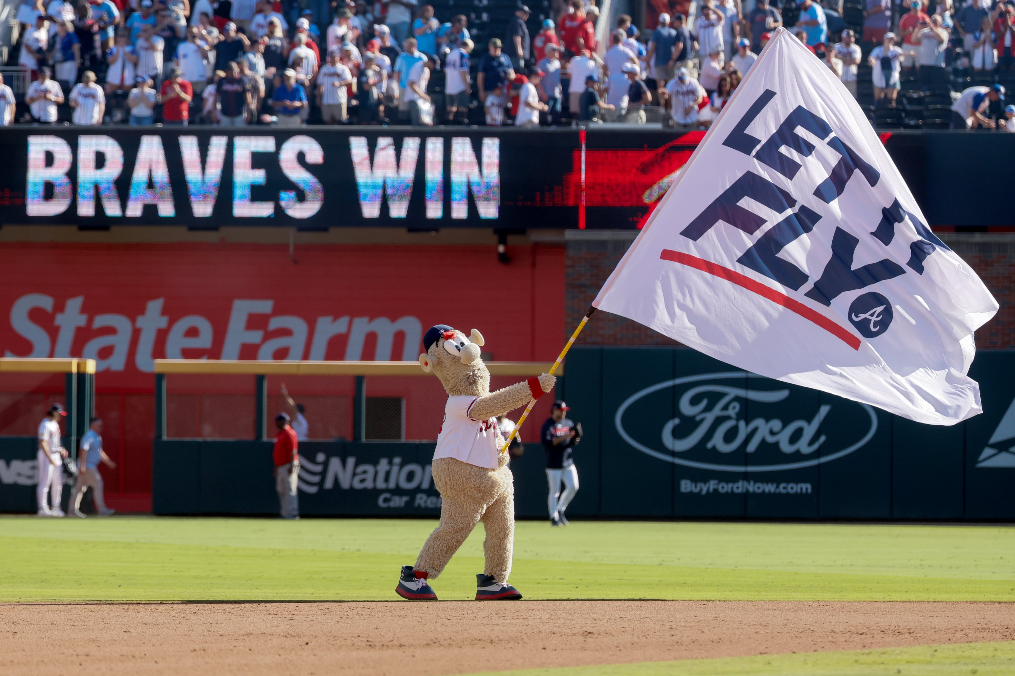 Blooper leads the cheering the fans after the Atlanta Braves defeated the Philadelphia Phillies in Game 1 of a MLB National League Wild Card playoff series between the Atlanta Braves and the Philadelphia Phillies, Tuesday, Sept. 29, 2026, in Atlanta. (Miguel Martinez/AJC)