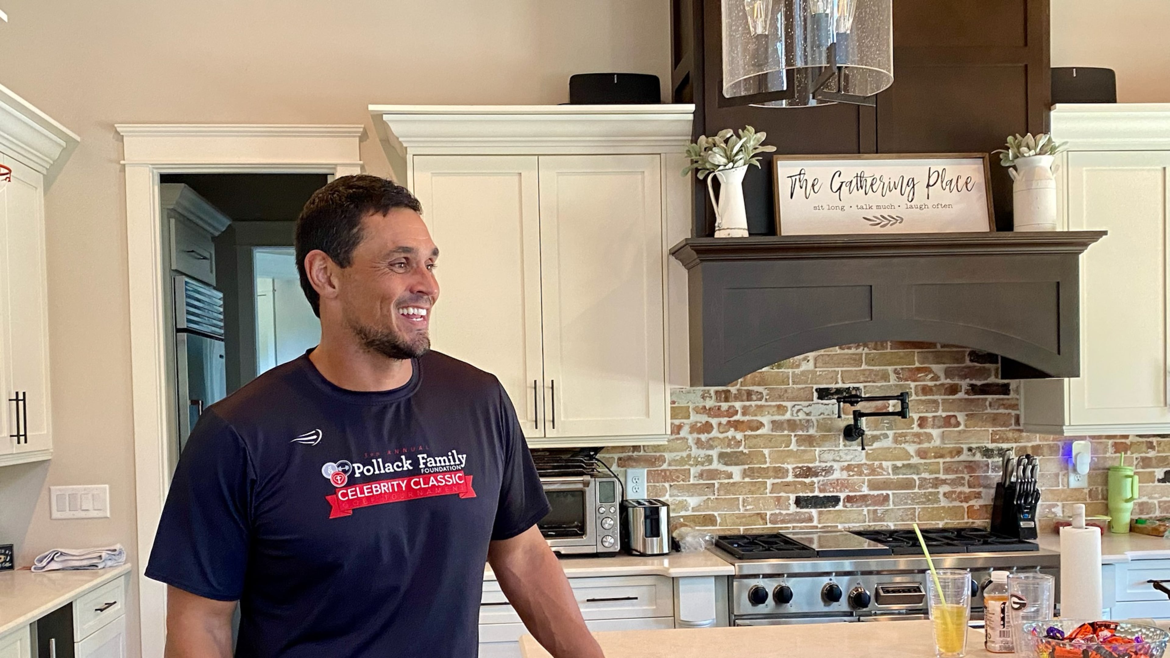 Georgia great and College Football Hall of Famer David Pollack speaks with a visitor to his Oconee County home in September 2024. (AJC photo by Ken Sugiura)