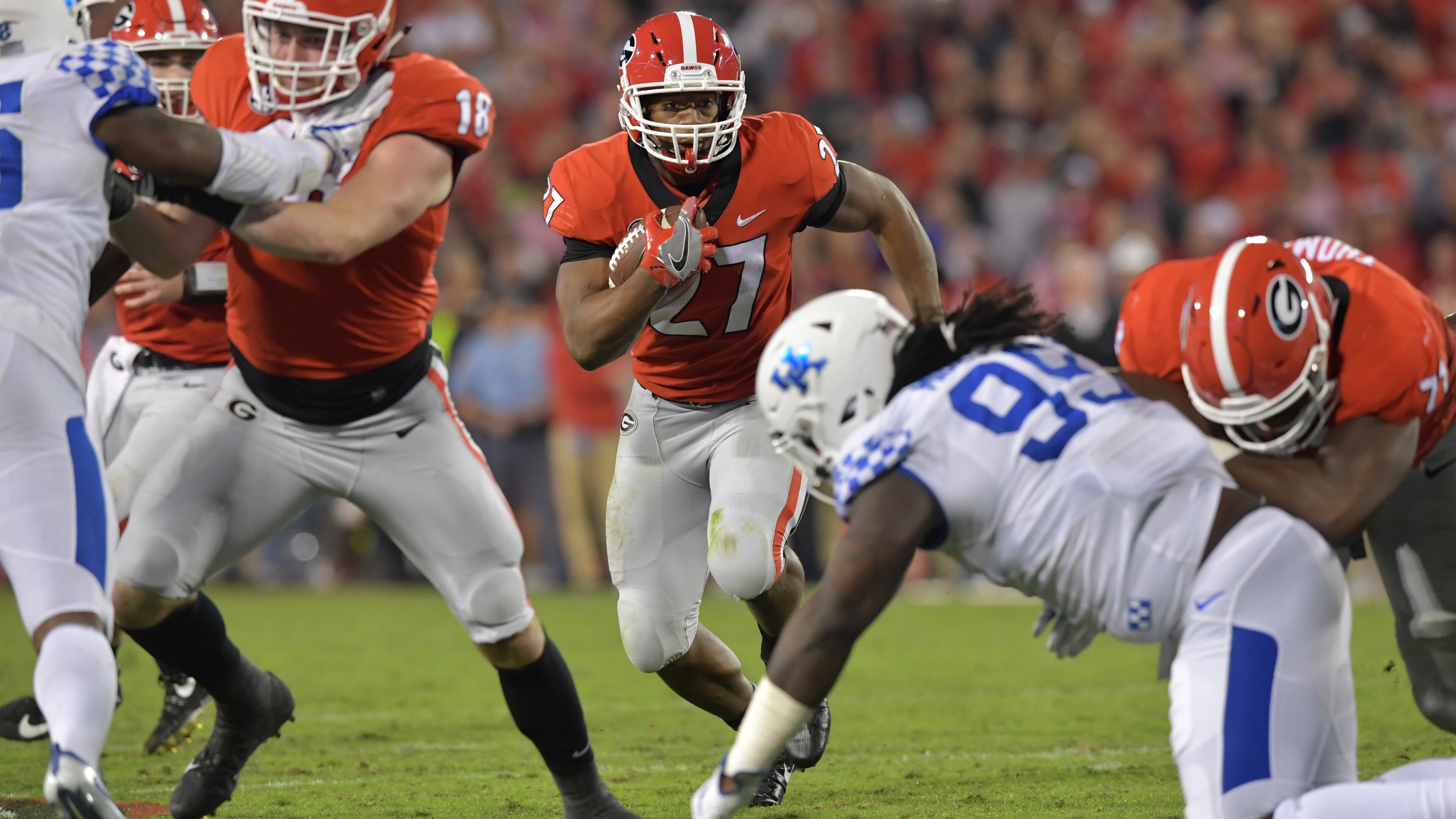 Georgia running back Nick Chubb (27) runs for a first down in the first half Saturday, Nov. 18, 2017, in their 42-13 win over Kentucky.