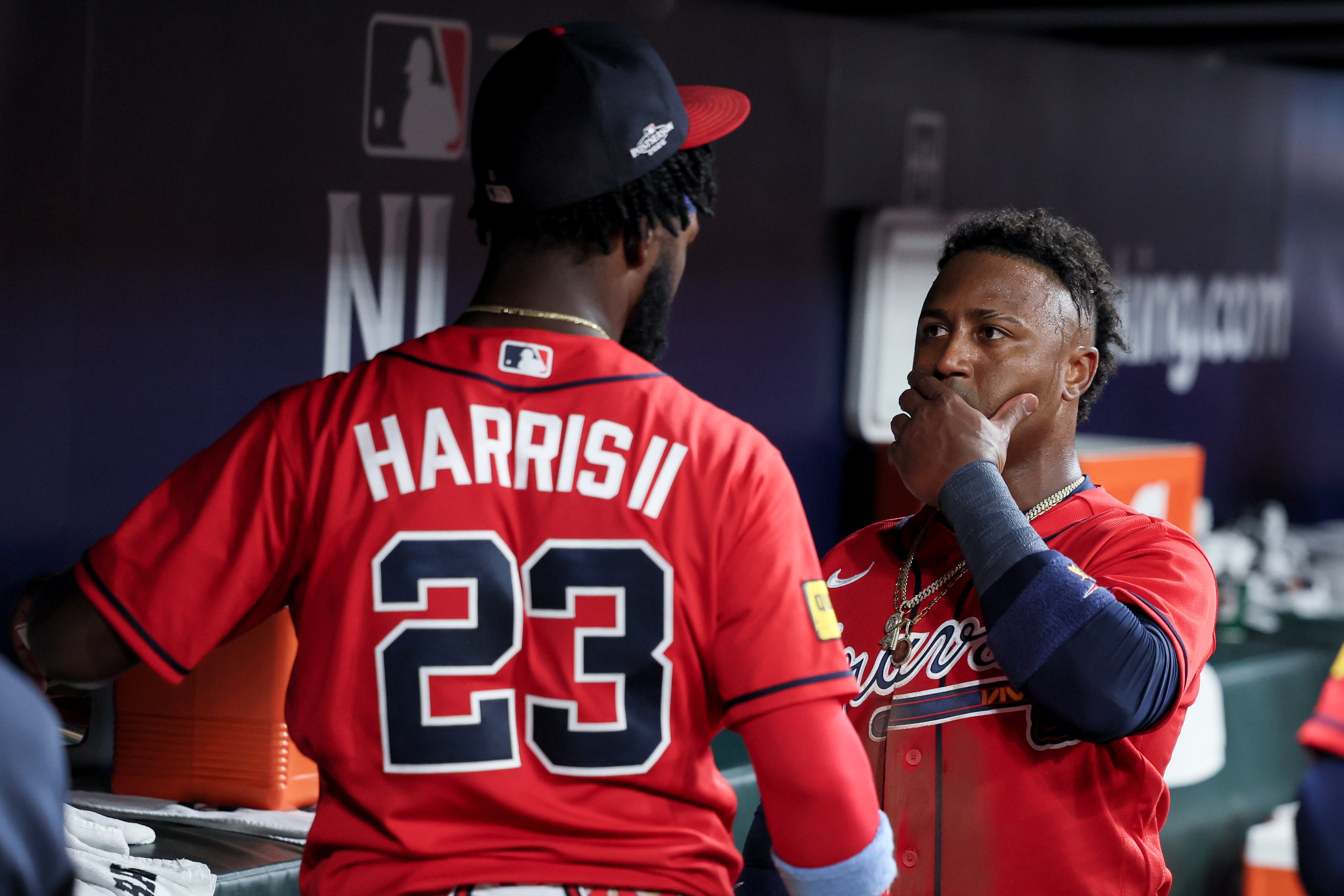 Atlanta Braves' Ozzie Albies, right, reacts with Michael Harris II (23) after losing to the Los Angeles Dodgers during the ninth inning of Game 3 of the MLB National League Division Series between the Atlanta Braves and the Los Angeles Dodgers, Tuesday, Oct. 6, 2026, in Atlanta. (Jason Getz/AJC)