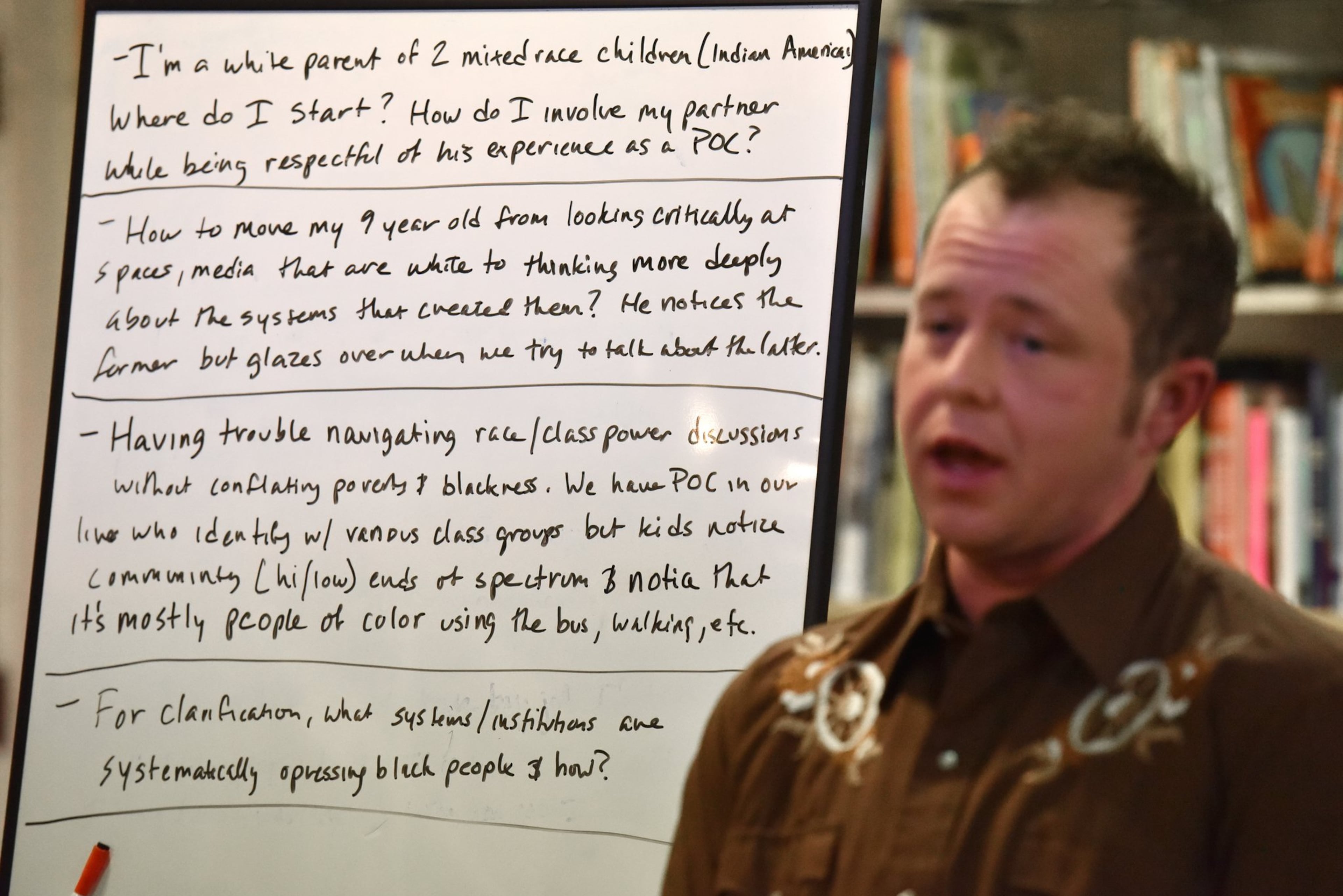 E.R. Anderson, executive director of Charis Circle, facilitates during a monthly Race-Conscious Parenting Collective meeting. HYOSUB SHIN / HSHIN@AJC.COM
