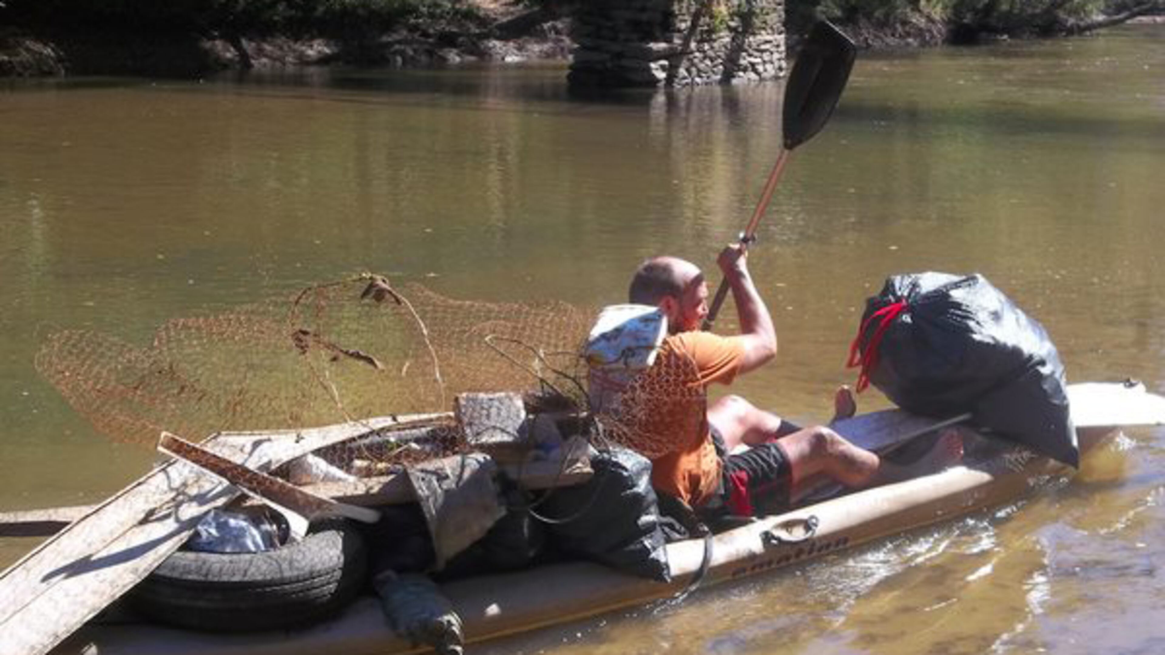 A volunteer transports a load of trash in a past cleanup of the Etowah River in Cherokee County. This year’s Etowah cleanup is Saturday, Oct. 26. UPPER ETOWAH RIVER ALLIANCE via Facebook