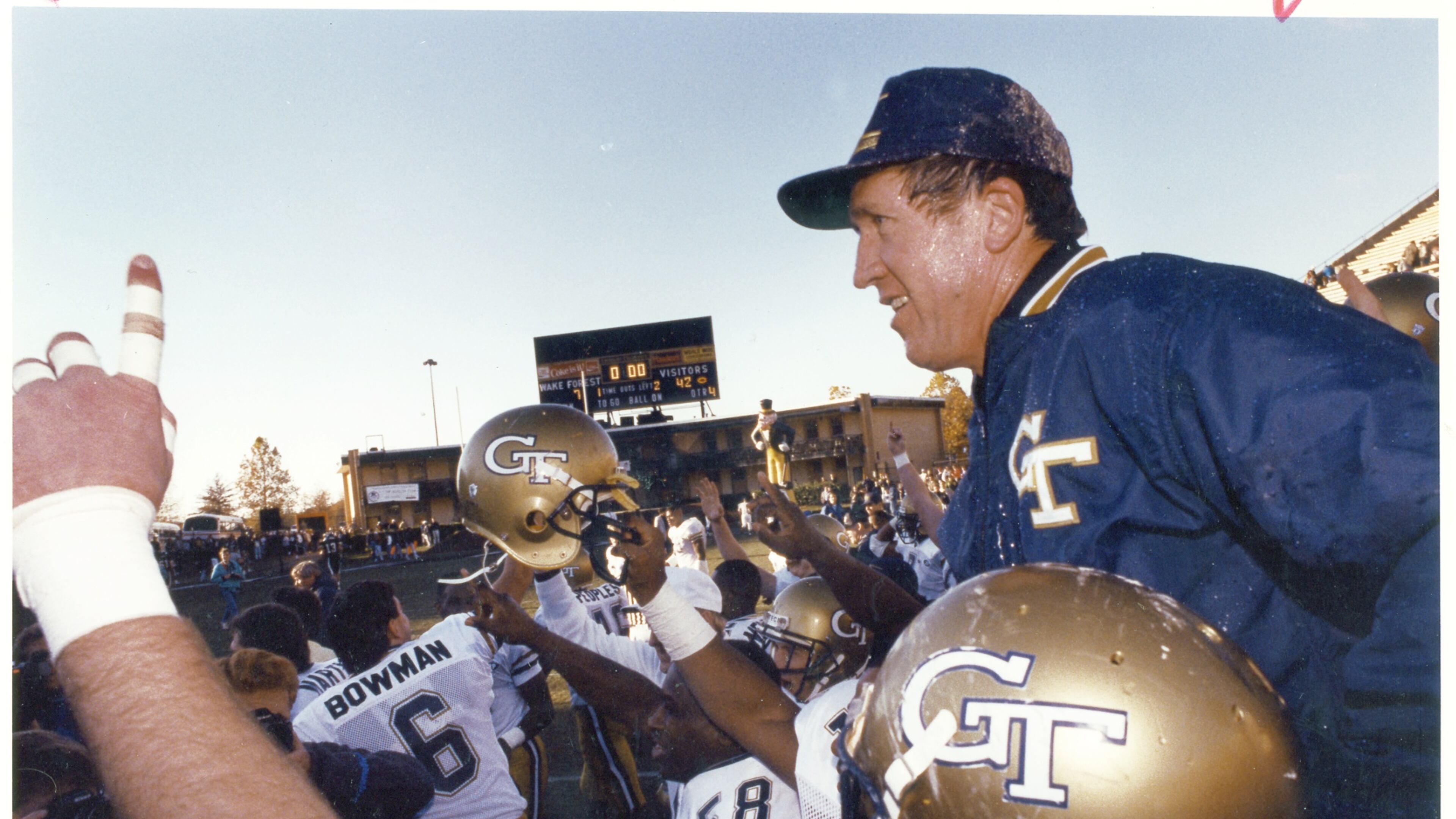 Georgia Tech coach Bobby Ross (right) is carried off the field by his players after beating Wake Forest and clinching the ACC championship in 1990. The Yellow Jackets went on to claim a share of the national championship. (Louie Favorite/AJC 1990)