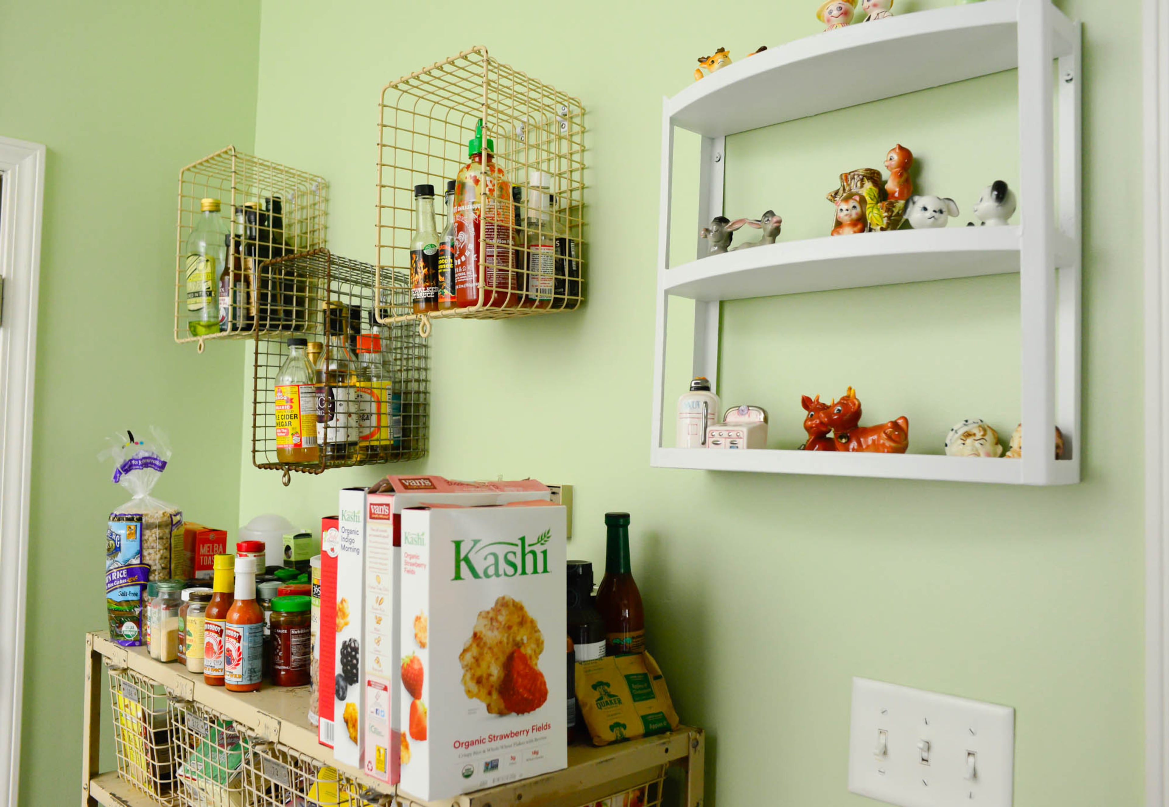 Vintage salt and pepper shakers that once belonged to Nash's great grandmother add whimsy and a sense of history to the 14-year-old bungalow's kitchen.