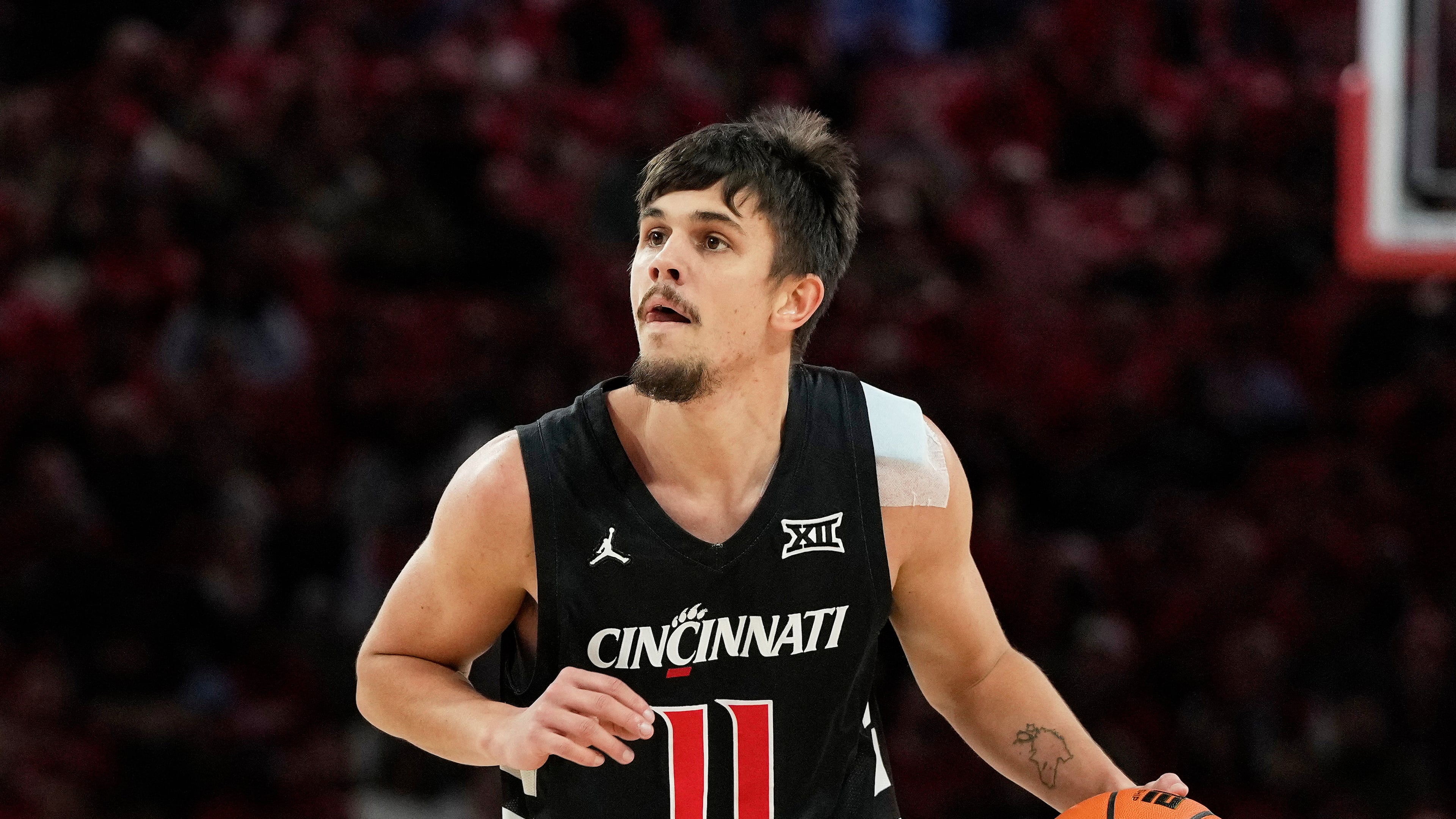 FILE - Cincinnati guard Kerr Kriisa (11) handles the ball during the first half of an NCAA college basketball game against Houston, Saturday, Jan. 31, 2026, in Houston. (AP Photo/Kevin M. Cox, File)