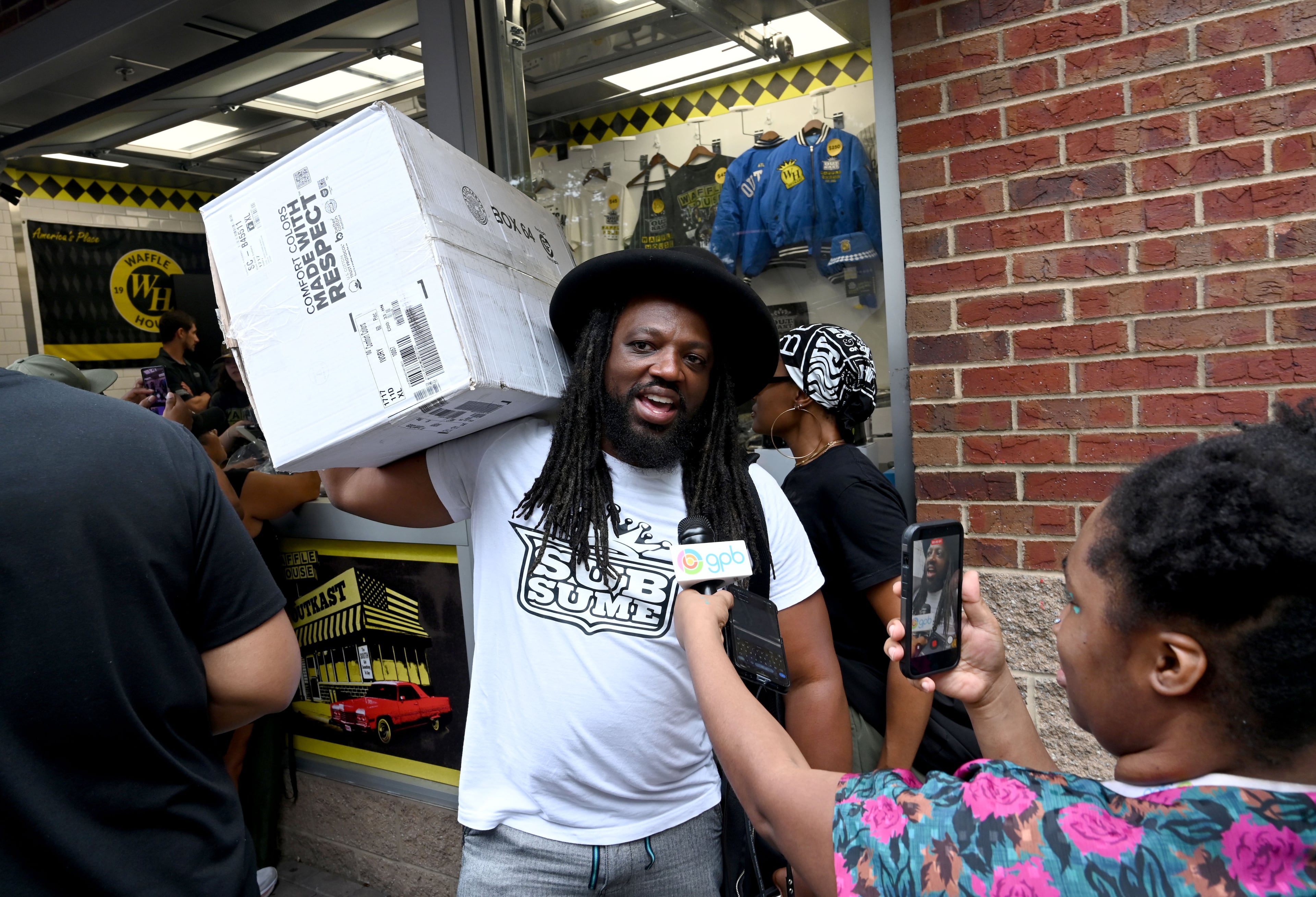 Dedren Snead arrived about 4:30 a.m. and was the first person in line. He walked out with a box of limited-edition apparel and accessories from the Outkast and Waffle House collaboration launch. (Hyosub Shin/AJC)
