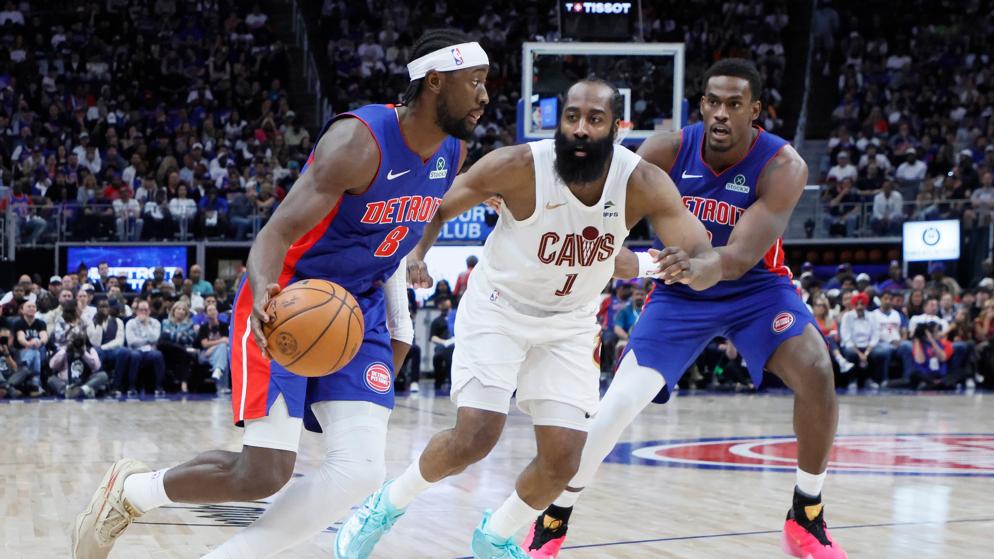 Detroit Pistons guard Caris LeVert (8) drives to the basket against Cleveland Cavaliers guard James Harden (1) with Pistons center Jalen Duren, right, helping on the play during the first half in Game 7 of a second-round NBA playoffs basketball series Sunday, May 17, 2026, in Detroit. (AP Photo/Duane Burleson)
