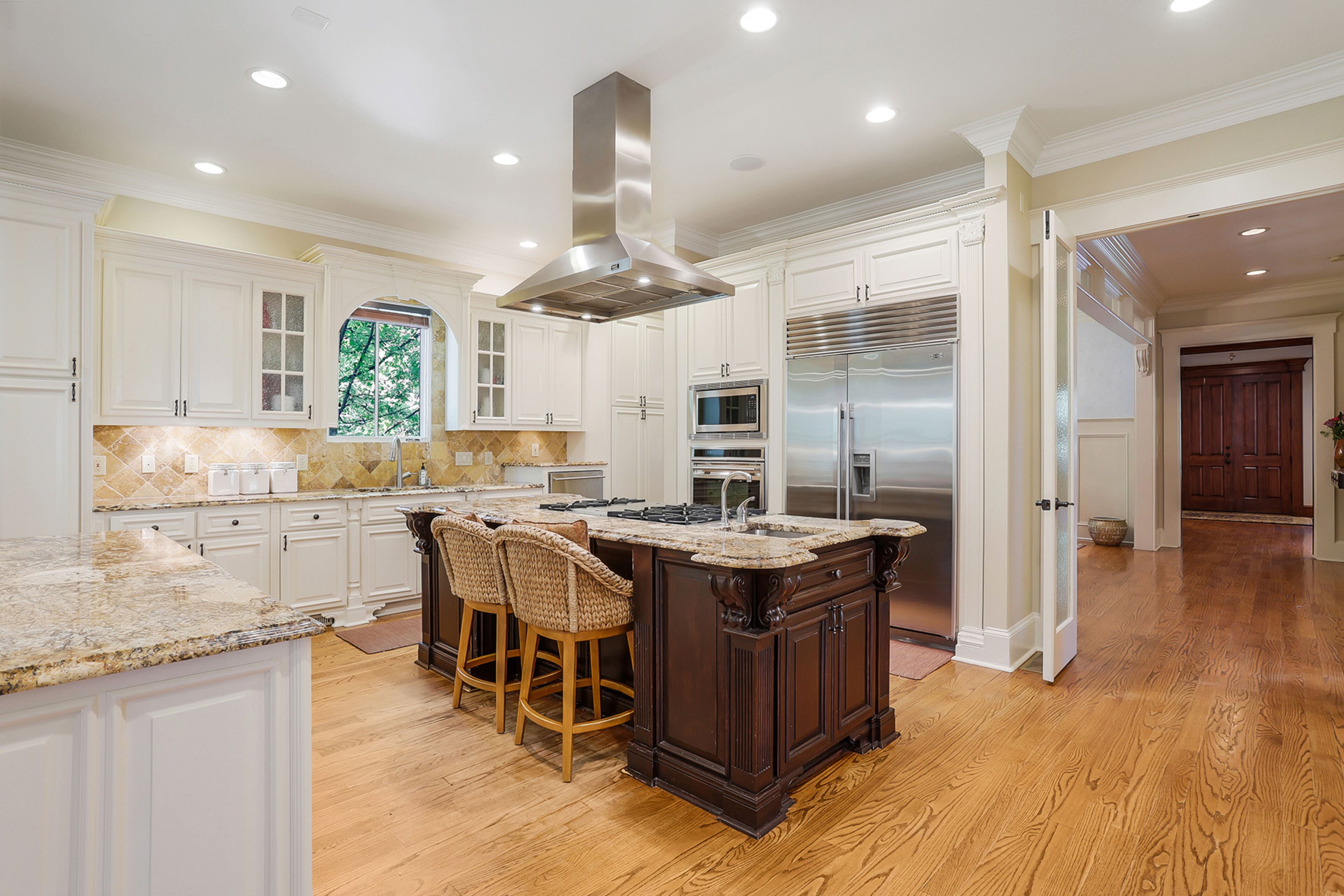 Spacious and functional updated gourmet kitchen. Text by Jim Cox