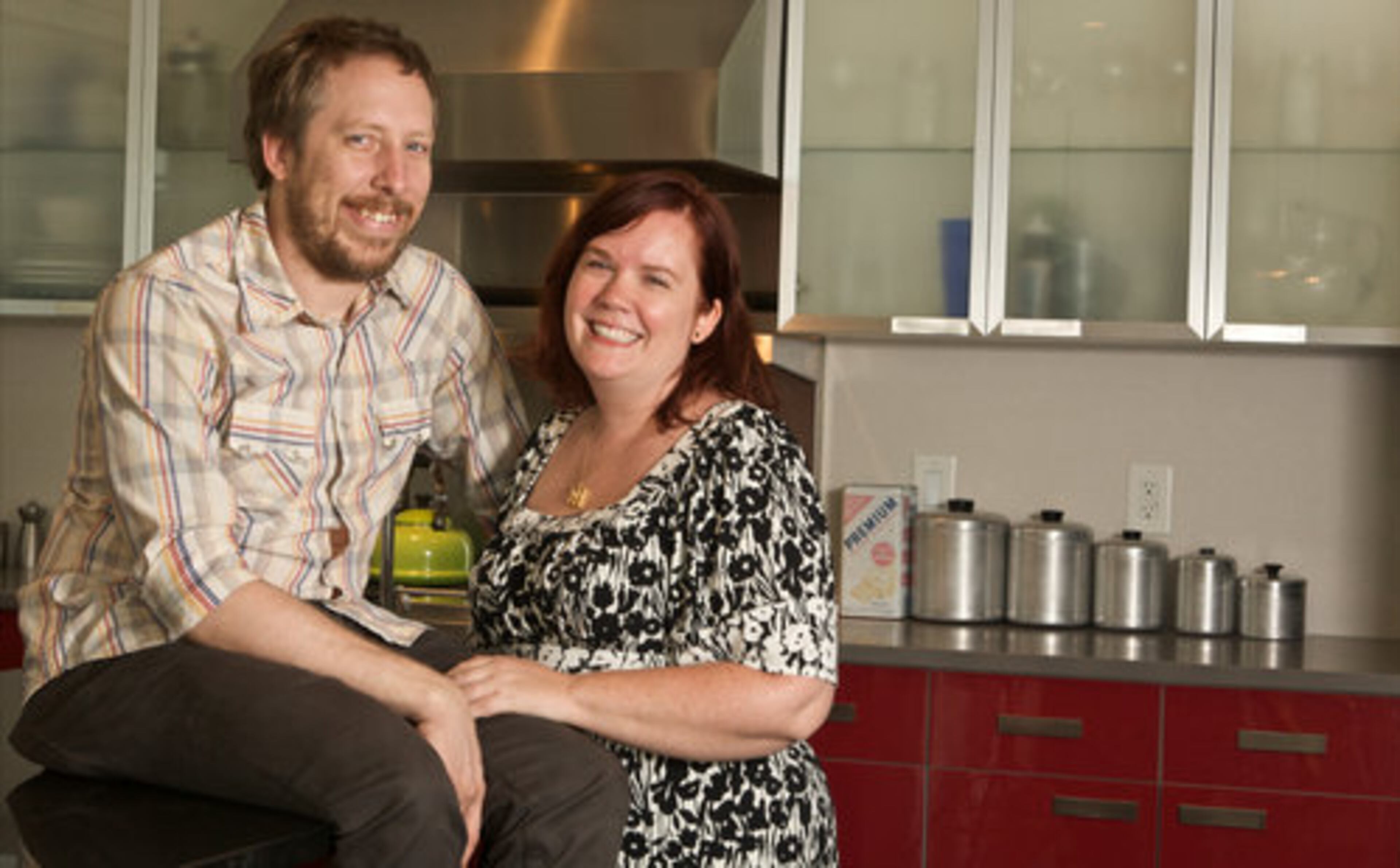 Justin and Jennifer Beals hang out in the kitchen of their modern, California-inspired home. "My favorite part of the home is definitely the kitchen. When we were designing the home the kitchen was the focal point. We even built a computer into the granite countertop to look up recipes," Jennifer says.
