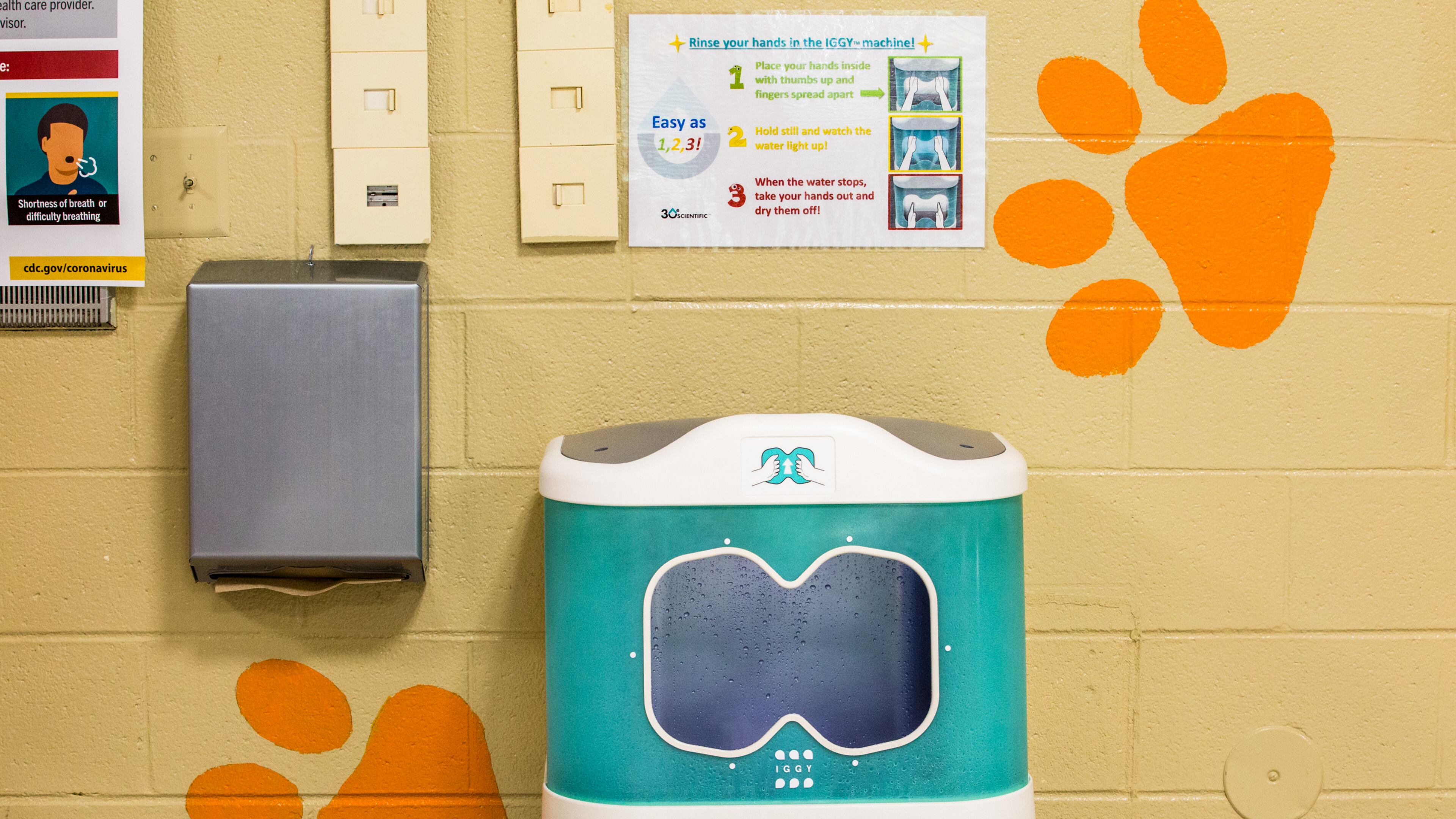 "Iggy" is a hand-rinsing station made by 3Oe Scientific that uses aqueous ozone to clean hands. Pictured here in the Bryant Elementary School cafeteria in Mableton in 2020, the purchase has proved controversial for the district over the past three years. The company has filed for bankruptcy protection. (Jenni Girtman for The Atlanta Journal-Constitution)