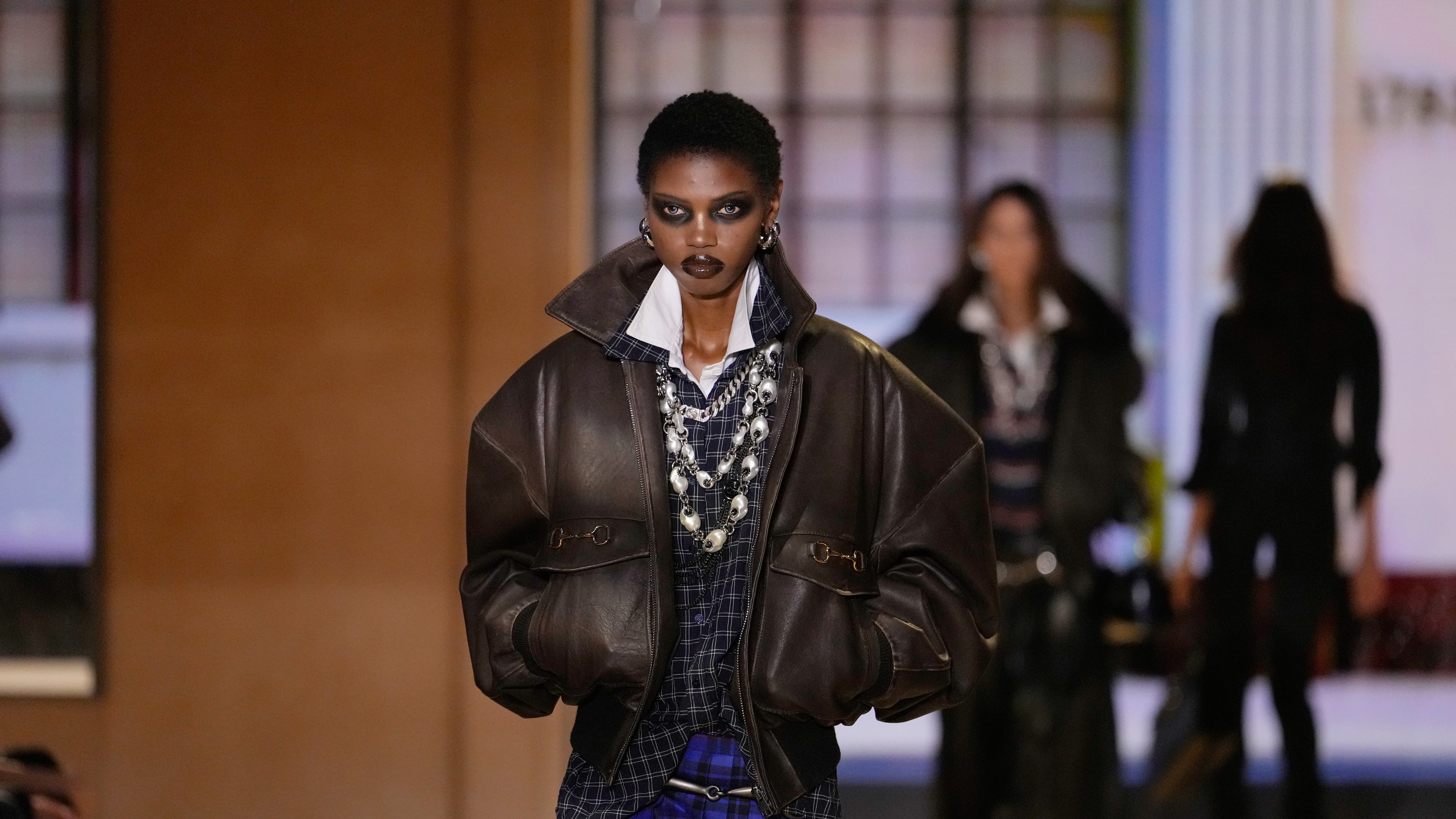 A model wears a creation part of the Gucci women's Spring-Summer 2027 collection, presented in Milan, Italy, Friday, Sept. 25, 2026. (AP Photo/Luca Bruno)