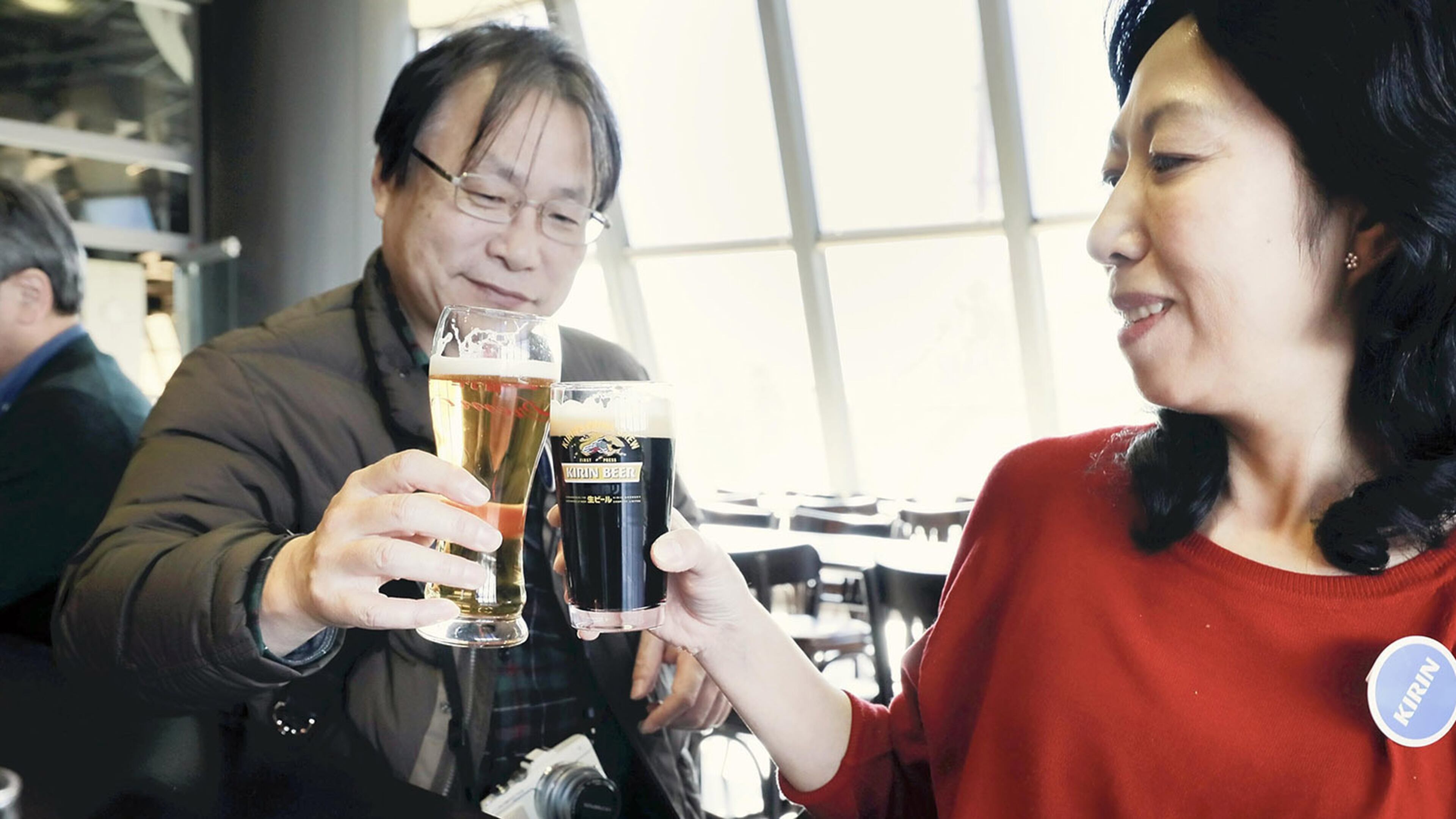 Visitors to the Kirin Brewery in Yokohama, Japan, top of their visit with a toast. Japan News-Yomiuri photo