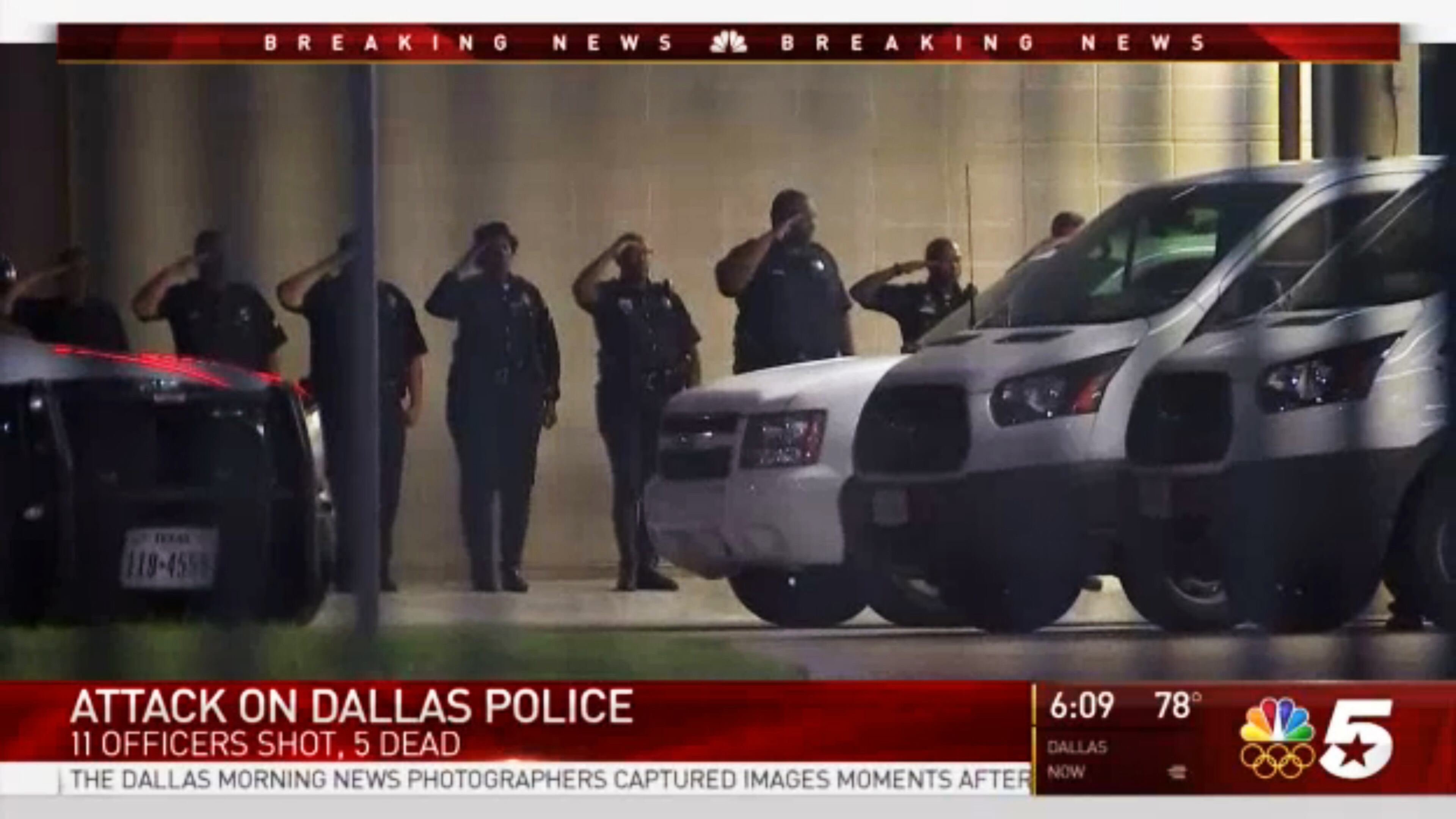 In this still image from video provided by NBC DFW, police officers salute their fallen peers outside Parkland Memorial Hospital in Dallas, where several officers were transported after shootings at a protest late Thursday, July 7, 2016. Five Dallas police officers were fatally shot and seven others wounded during a protest over the deaths of black men killed by police this week in Louisiana and Minnesota. It was the deadliest day for U.S. law enforcement since the Sept. 11, 2001, terrorist attacks. (NBC DFW via AP)