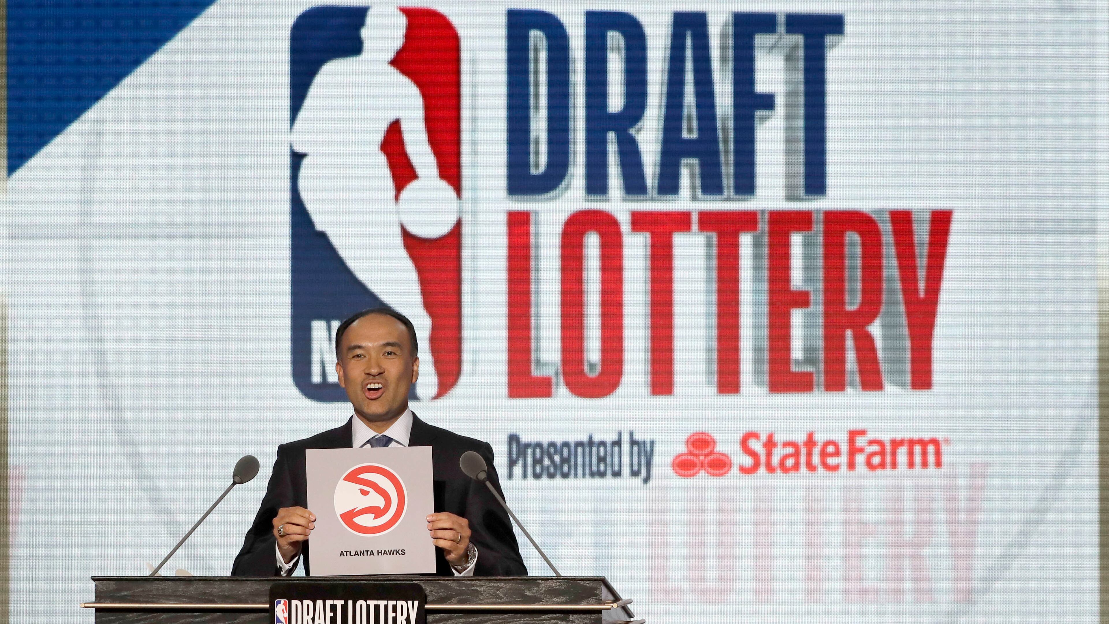 NBA Deputy Commissioner Mark Tatum announces that the Atlanta Hawks won the third pick during the NBA basketball draft lottery Tuesday, May 15, 2018, in Chicago.