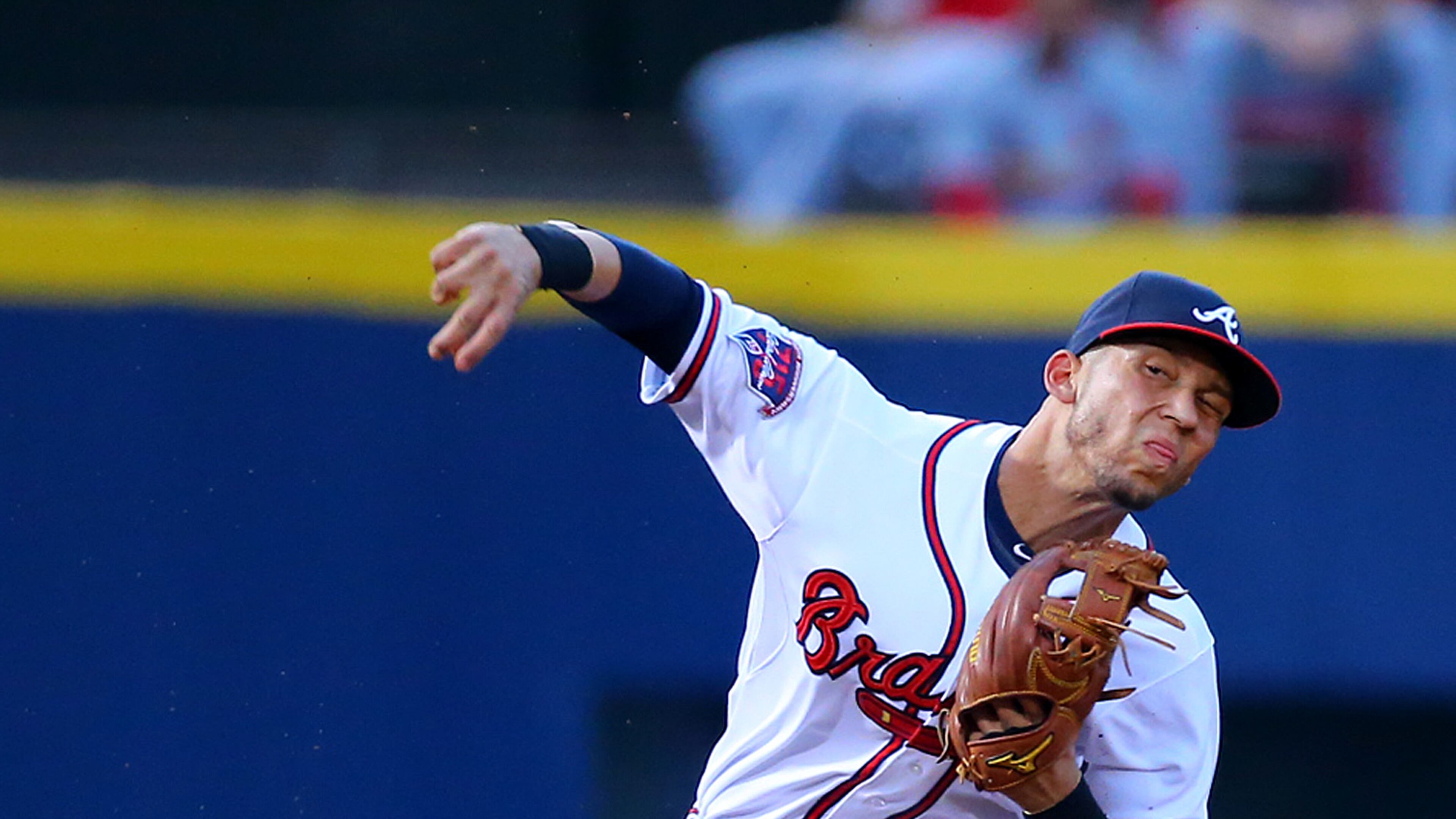 Braves shortstop Andrelton Simmons knocks down a hard hit ball by Cardinals Yadier Molina and throw to first during their MLB game on Monday, May 5, 2014, in Atlanta.