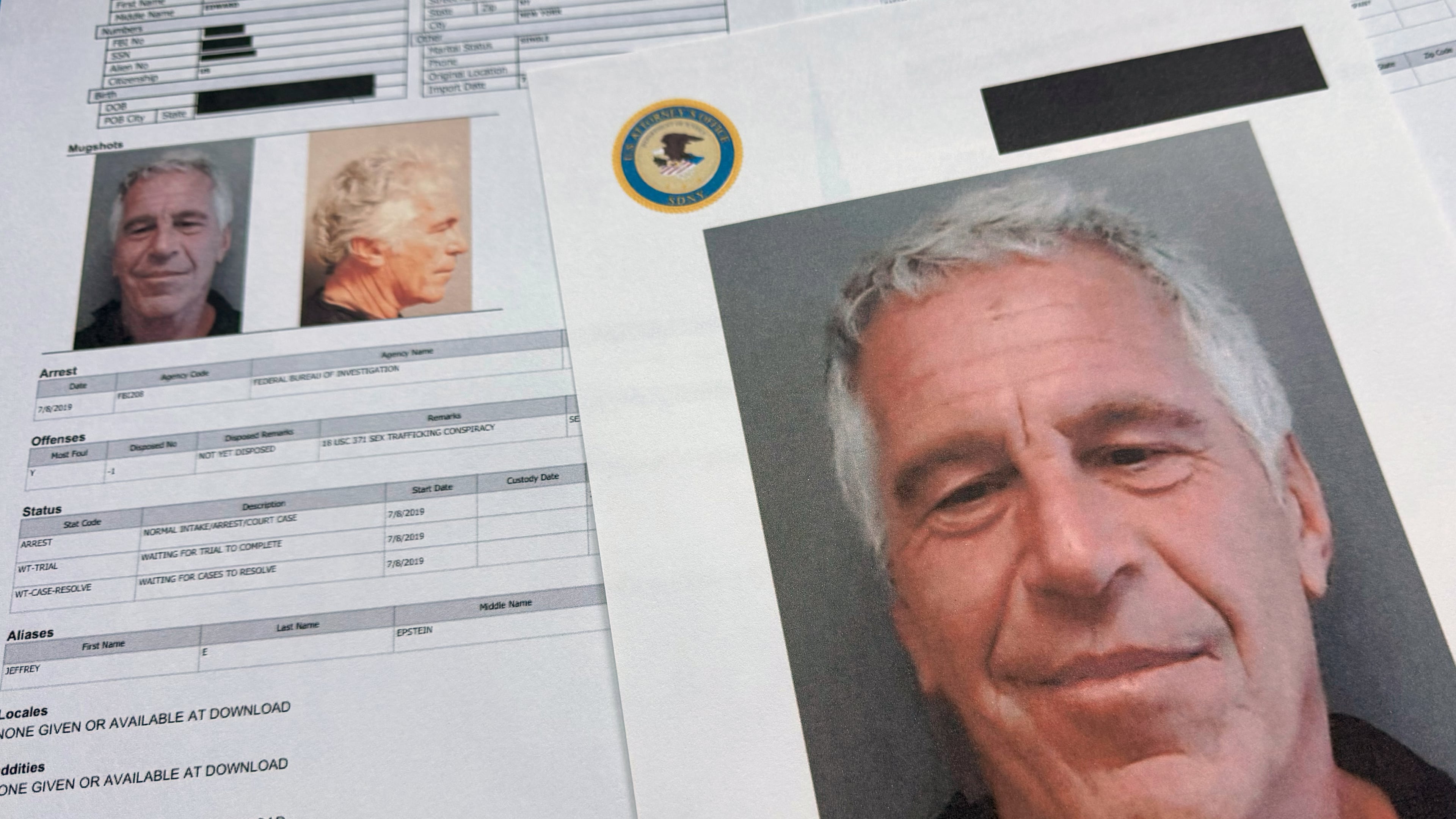 FILE - Documents that were included in the U.S. Department of Justice release of the Jeffrey Epstein files are photographed on Jan. 2, 2026. (AP Photo/Jon Elswick, File)