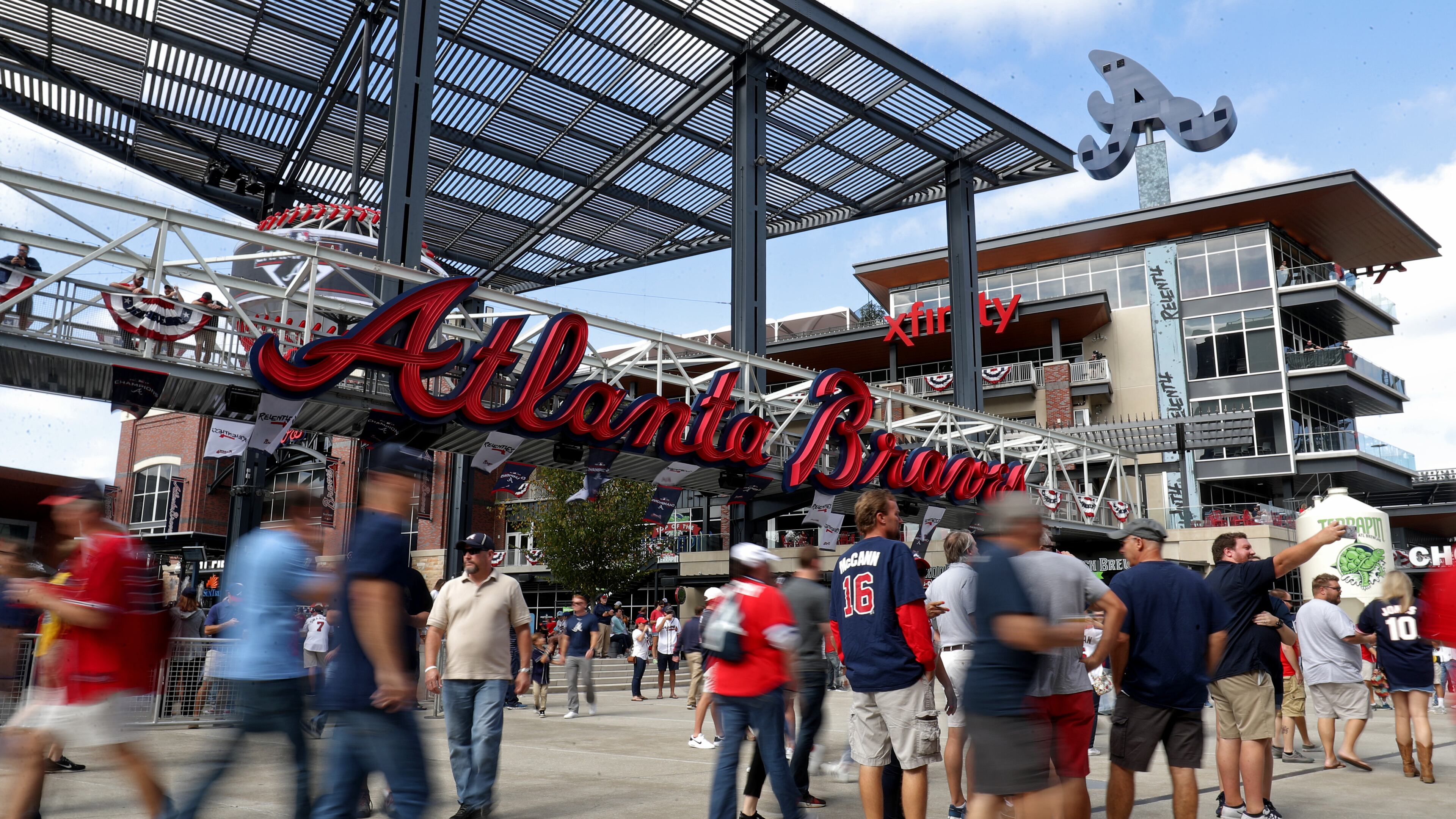 Braves fans enjoy The Battery Atlanta before a playoff game last October. The Braves have spent a lot of money developing the mixed-use complex adjacent to their stadium.