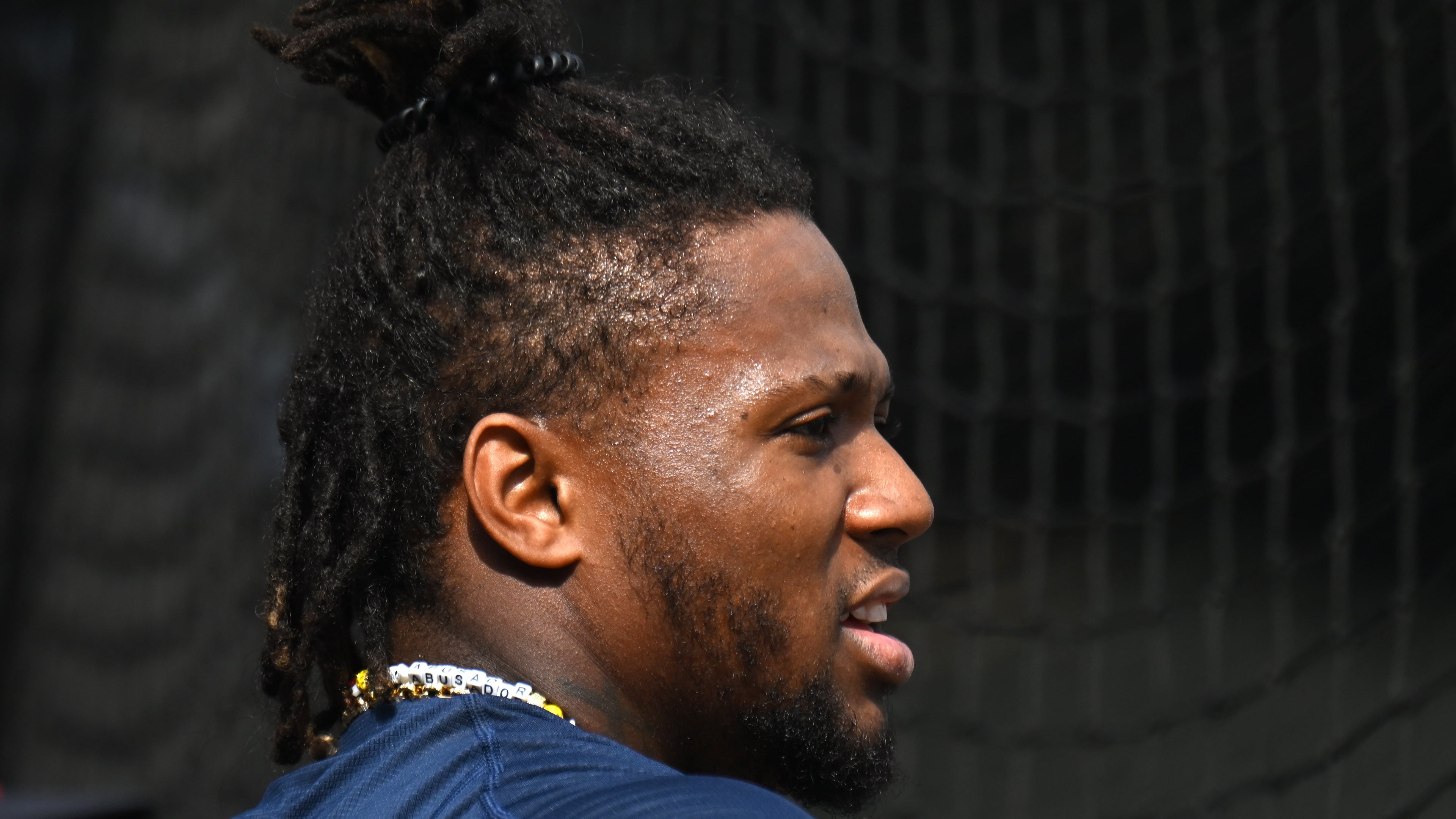 Atlanta Braves right fielder Ronald Acuna Jr. talks with teammates and coaching staff before taking batting practice during spring training workouts at CoolToday Park, Feb. 16, 2024, in North Port, Florida. (Hyosub Shin / Hyosub.Shin@ajc.com)