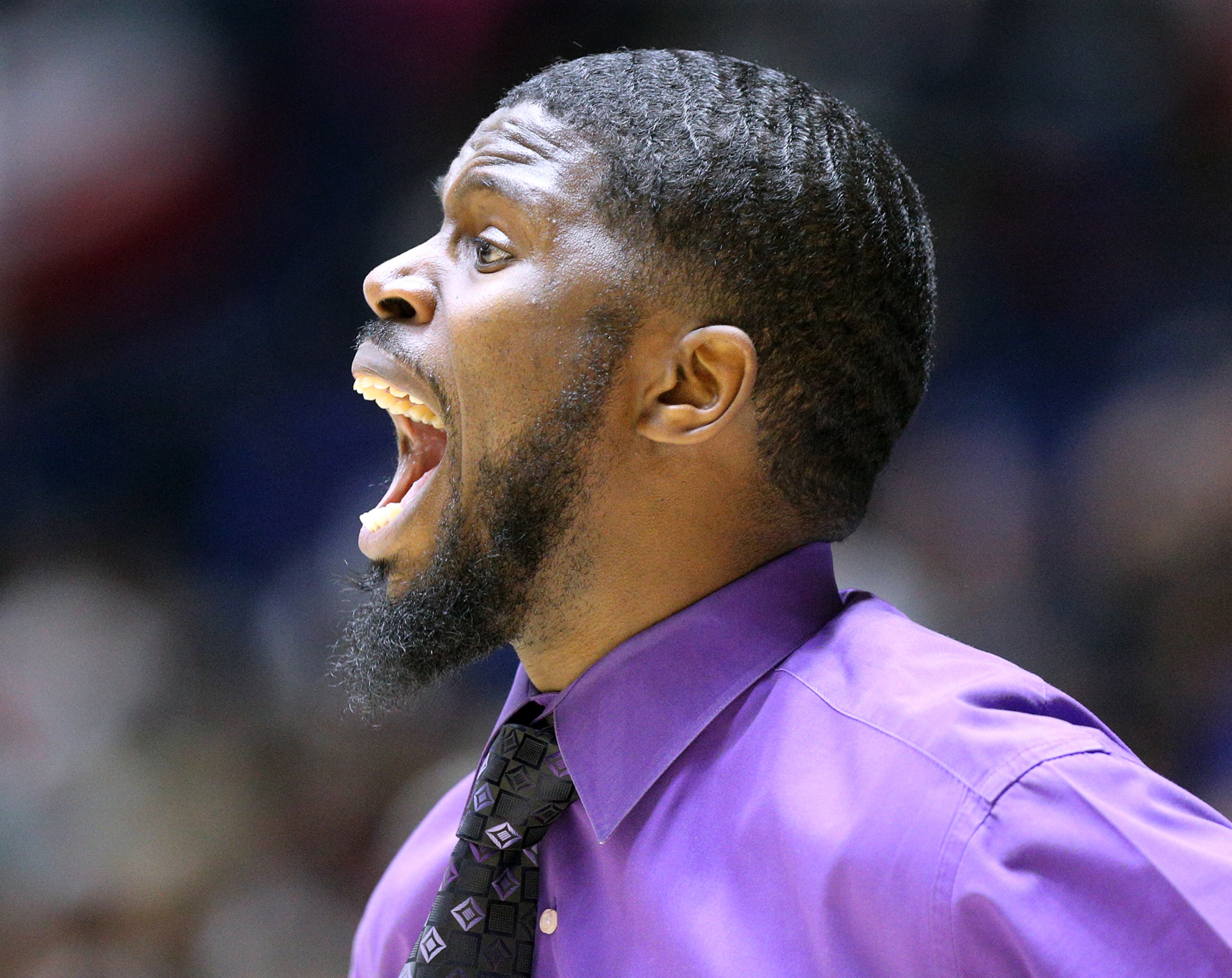 March 8, 2018 Macon: Miller Grove head coach Rasul Chester incourages his players in the final minutes against Warner Robins in their GHSA state basketball championship game on Thursday, March 8, 2018, in Macon. Curtis Compton/ccompton@ajc.com