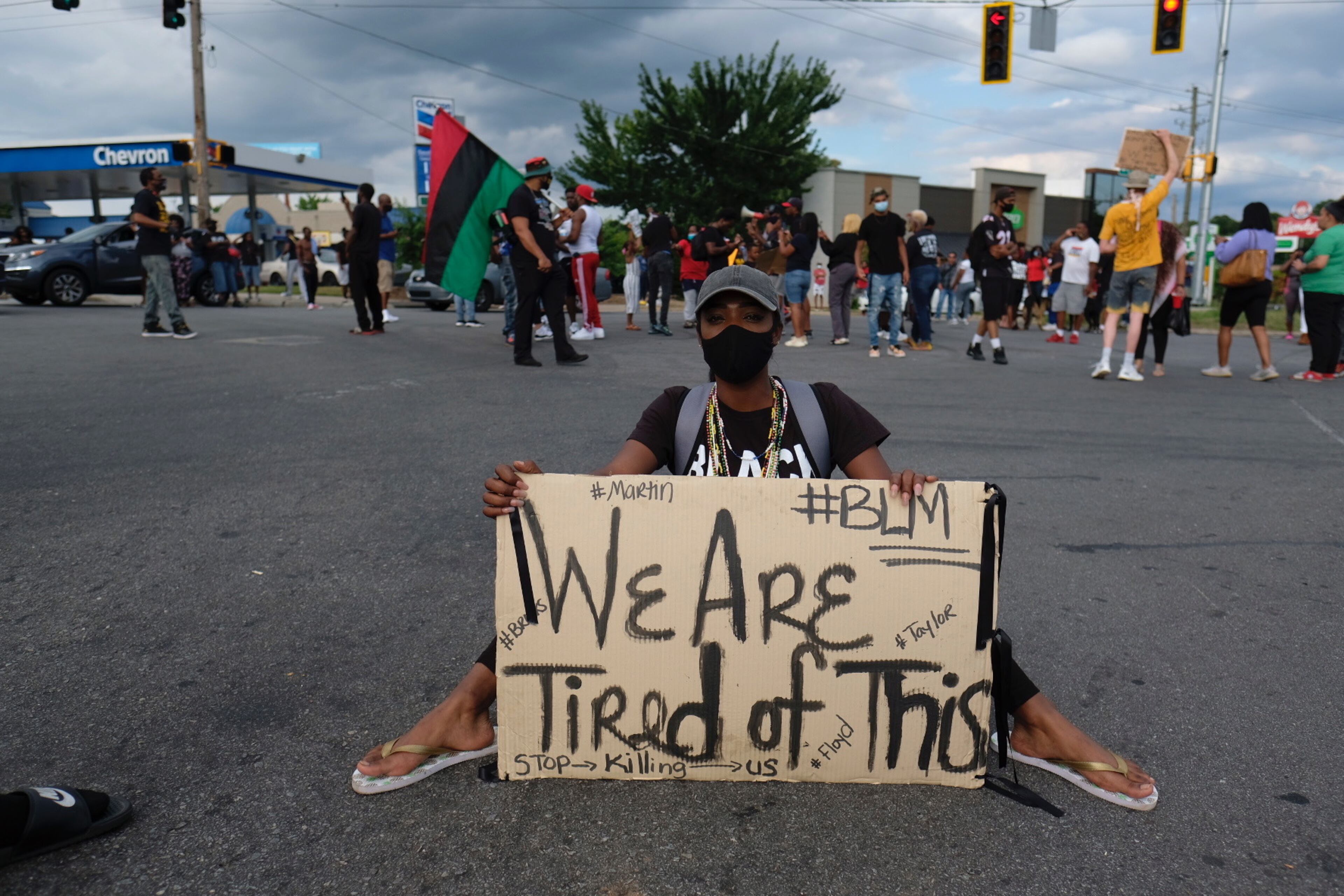 June 17, 2020 - Atlanta - A protestor sits on University Avenue in Atlanta, near the Wendy's where Rayshard Brooks was shot and killed.
Ben Gray for the Atlanta Journal Constitution