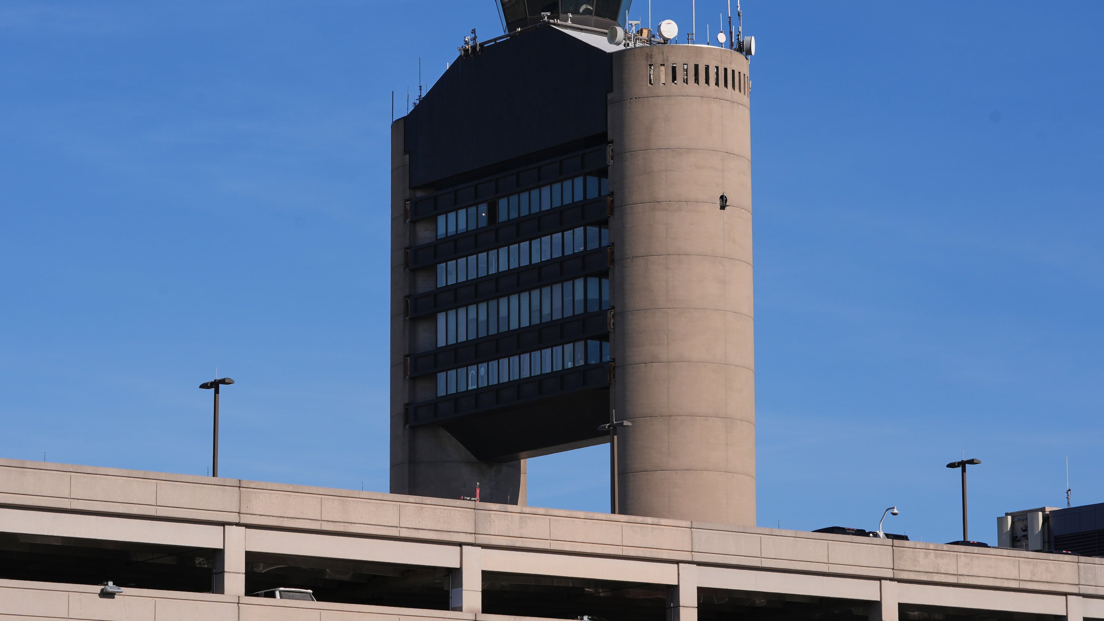 FILE - The control tower at Logan Airport, on Dec. 9, 2025, in Boston. (AP Photo/Charles Krupa, File)
