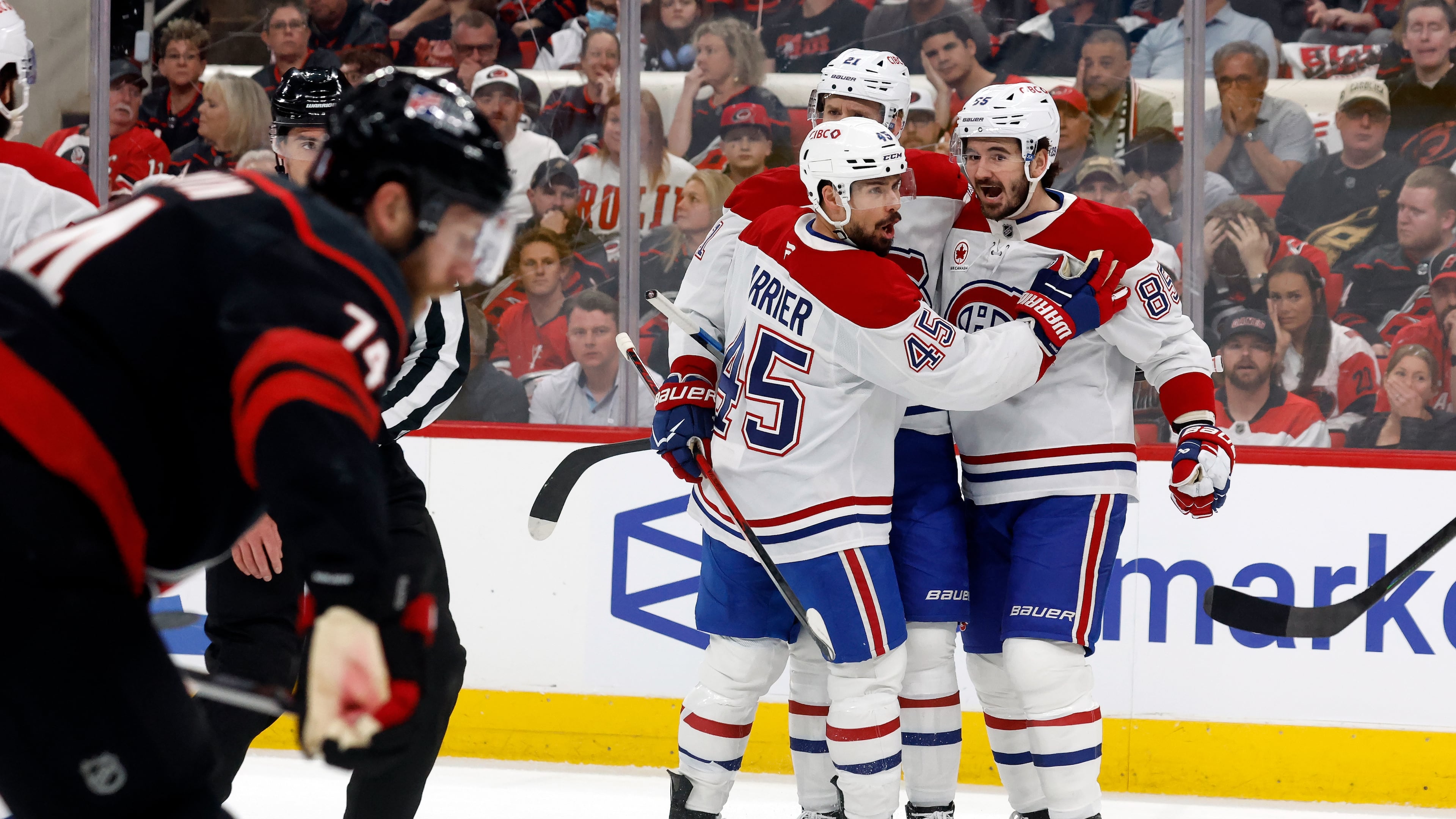 Montréal Canadiens celebrate their third goal during the first period in Game 1 of the Eastern Conference finals NHL hockey Stanley Cup playoffs series against the Carolina Hurricanes in Raleigh, N.C., Thursday, May 21, 2026. (AP Photo/Karl DeBlaker)