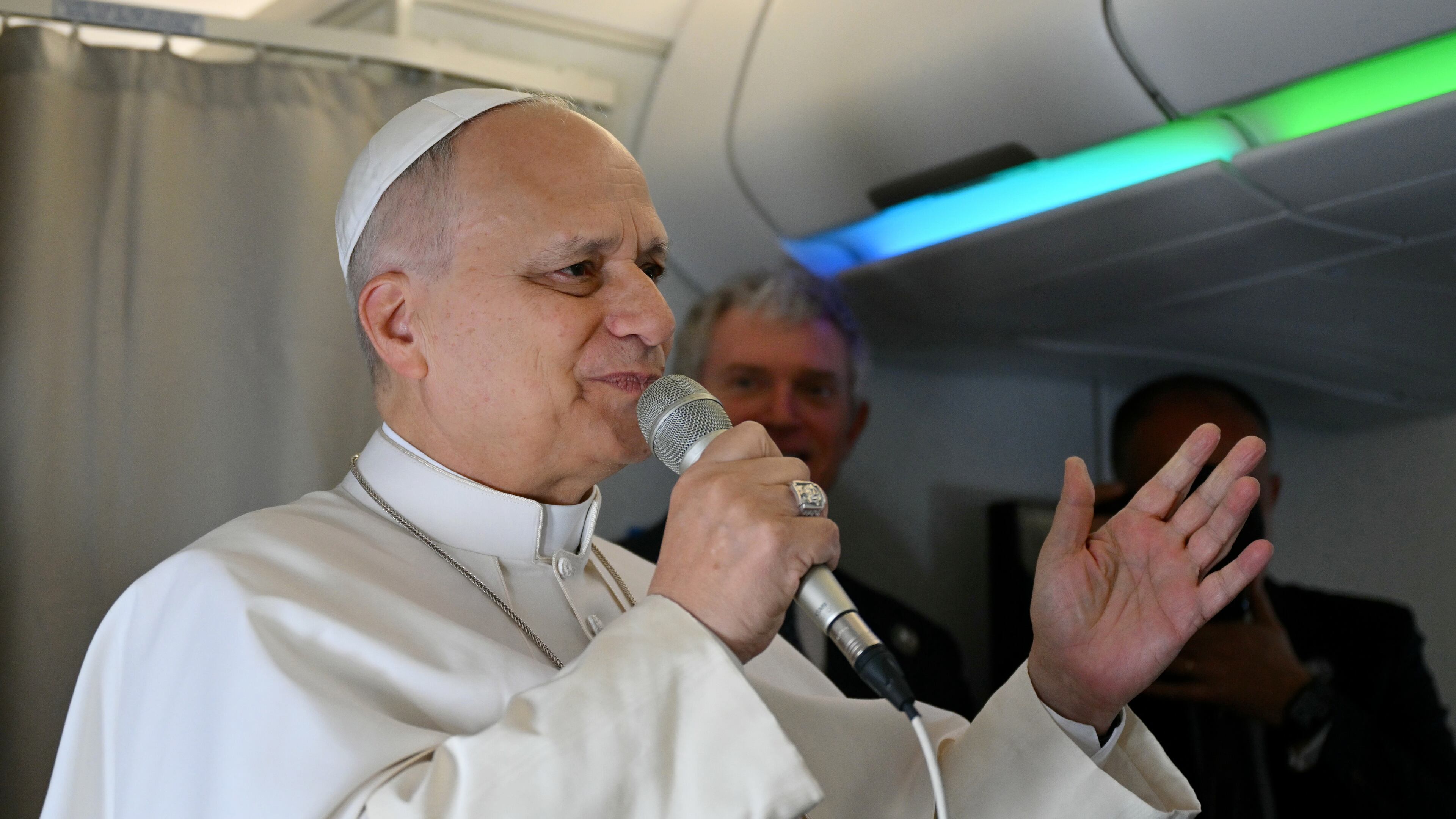 Pope Leo XIV speaks to journalists aboard his flight bound for Algiers’ Houari Boumédiène International Airport on Monday, April 13, 2026, at the start of an 11-day apostolic journey to Africa. (Alberto Pizzoli/Pool Photo via AP)