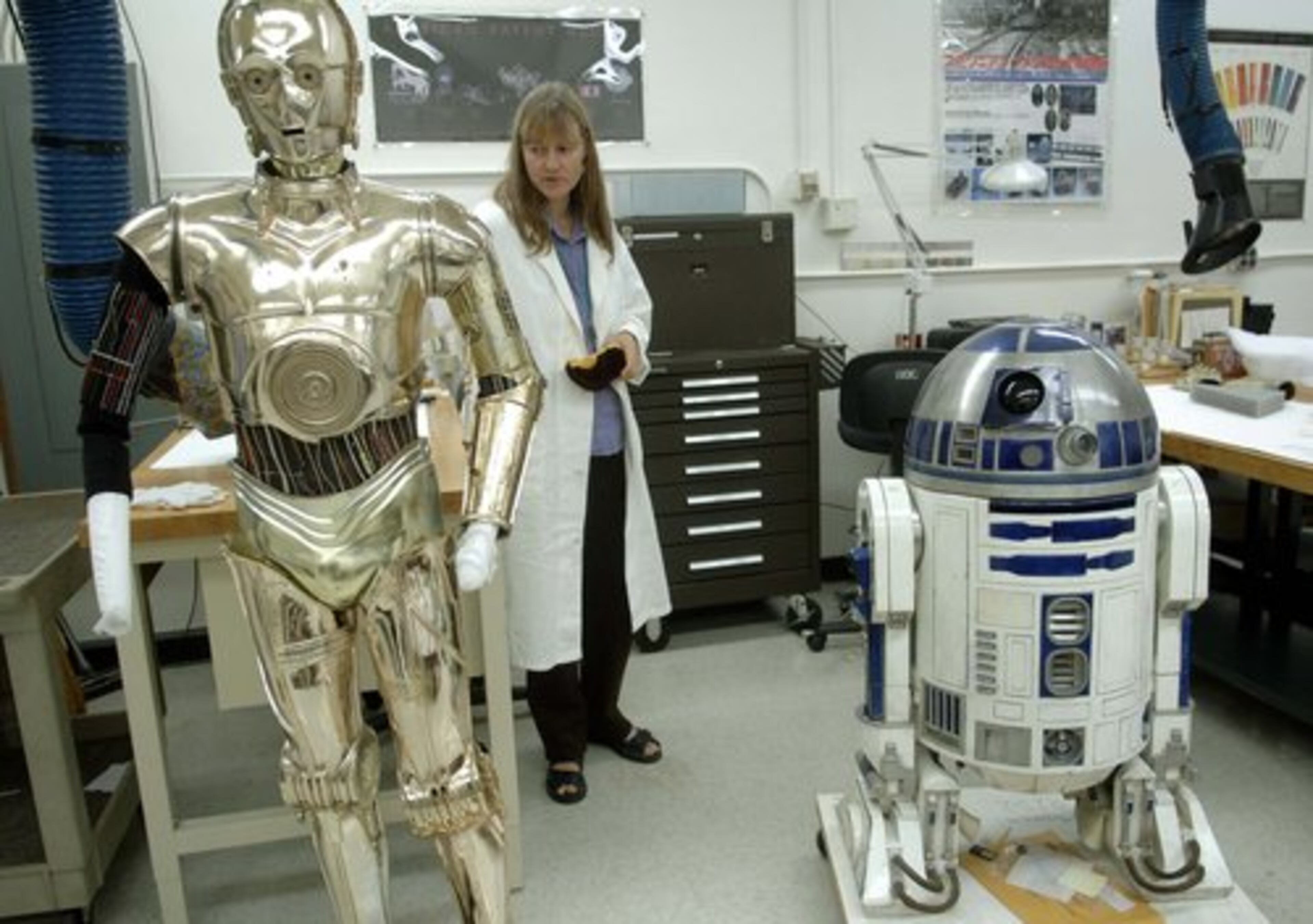 BEFORE THE renovation, conservator Beth Richwine prepares C3PO and R2D2 from "Star Wars" for their temporary home.