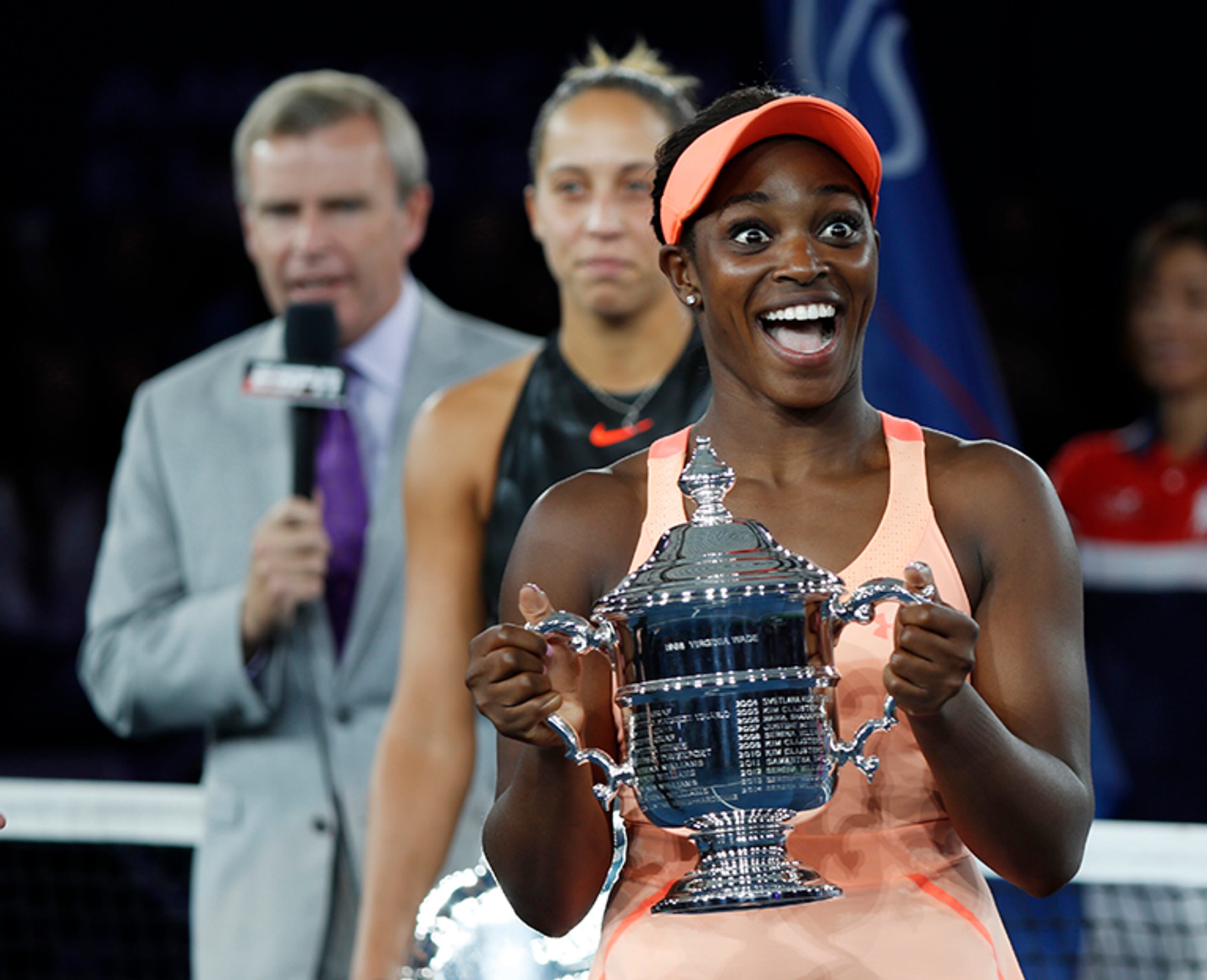 Sloane Stephens, of the United States, reacts with the championship trophy after beating Madison Keys, of the United States, in the women's singles final of the U.S. Open tennis tournament, Saturday, Sept. 9, 2017, in New York. (AP Photo/Adam Hunger)
