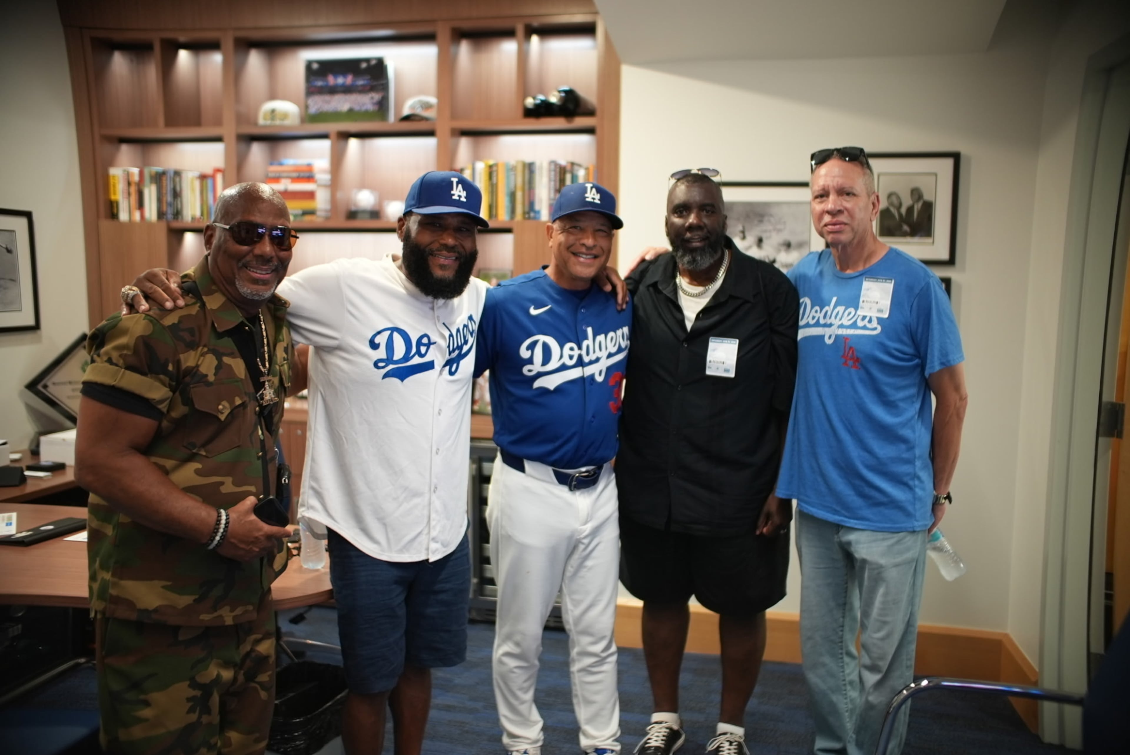 From left, EDU Inc. founder Robert A. Mason meets with actor Anthony Anderson, Los Angeles Dodgers manager Dave Roberts, North Carolina Central University admissions director Michael A. Bailey and Corey English before the Dodgers game Sunday, Aug. 2, 2026. (Courtesy of Michael A. Bailey)