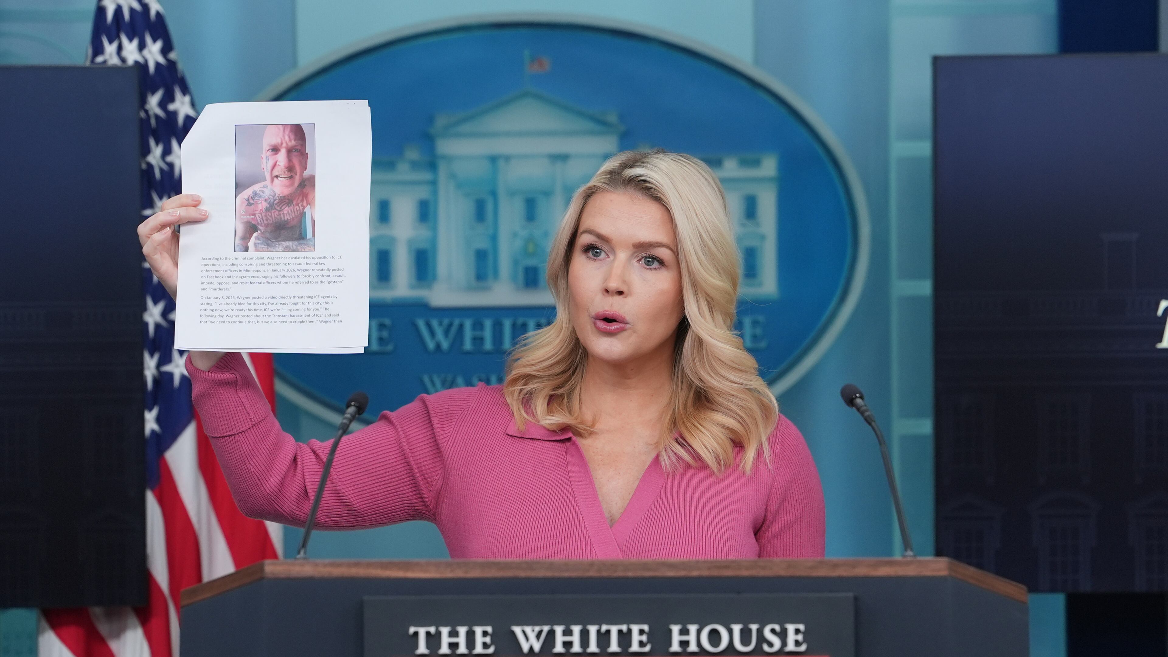 White House press secretary Karoline Leavitt holds a photo of Kyle Wagner, as she speaks during a briefing at the White House, Thursday, Feb. 5, 2026, in Washington. (AP Photo/Evan Vucci)