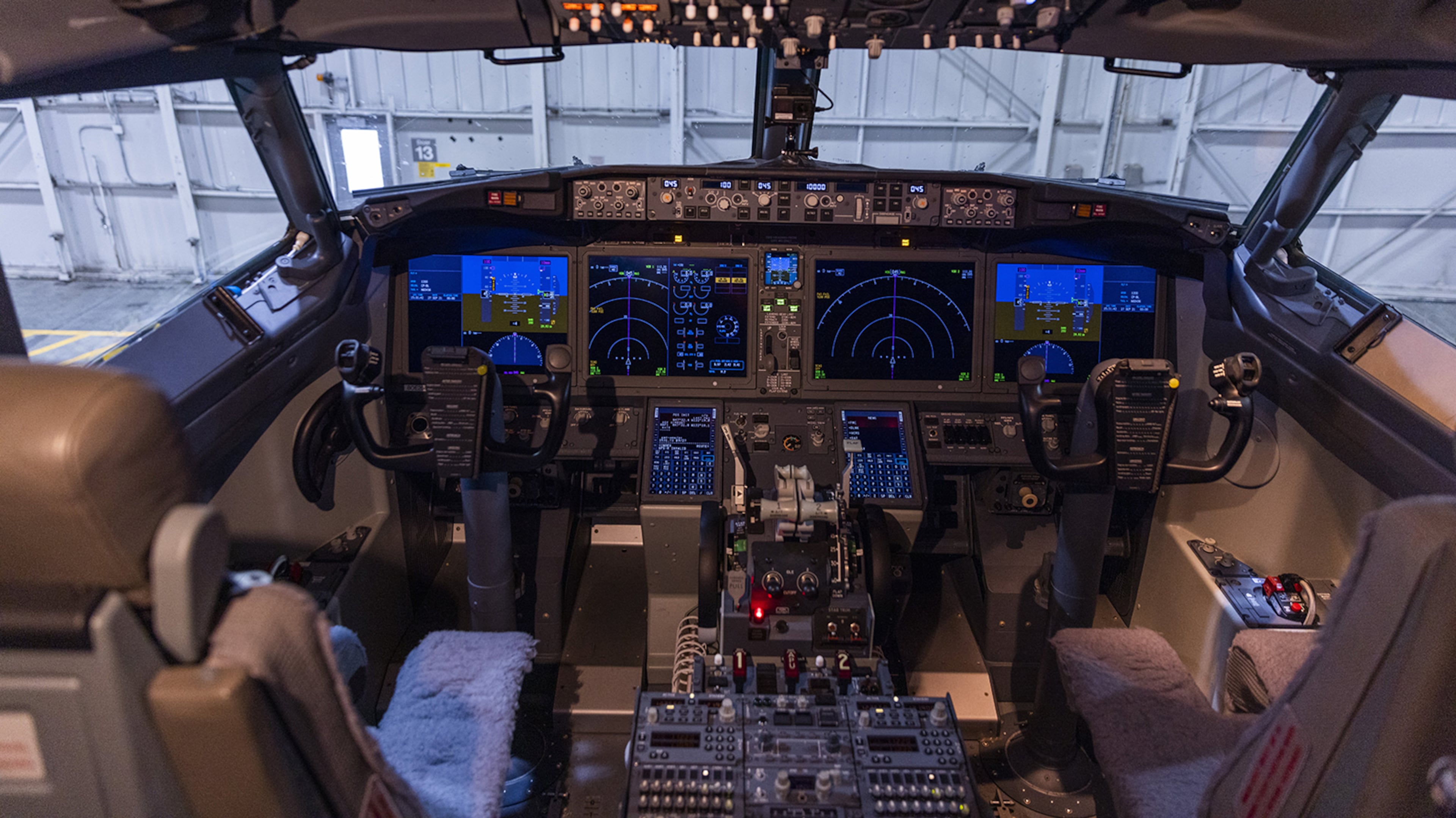 The control board lights up in the Boeing ecoDemonstrator cockpit in a hanger at Boeing Field on Sept. 27, 2021. (Daniel Kim/Seattle Times/TNS)