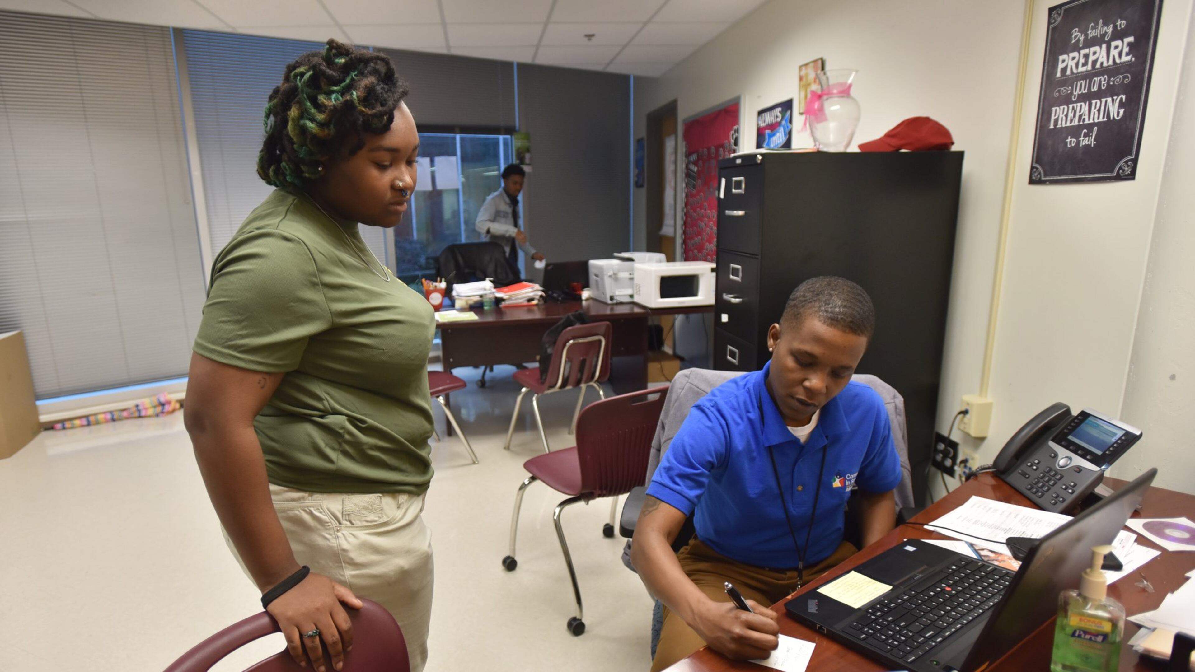 February 7, 2018 Atlanta - Valencia Dennis, student support coach, consults with Kyrsten Burch,18, during their Target 2021 program session at Maynard Jackson High School on Wednesday, Feb. 7, 2018. After a year and a half and $7.5 million, Atlanta Public Schools can show only mixed or inconclusive results for a program intended to support the student victims of a major cheating conspiracy. A recent evaluation of the Target 2021 program — named for the graduation year of the youngest Atlanta students caught up in the cheating conspiracy— shows scant evidence that the initiative is helping those children whose answers on standardized tests were changed by educators. HYOSUB SHIN / HSHIN@AJC.COM