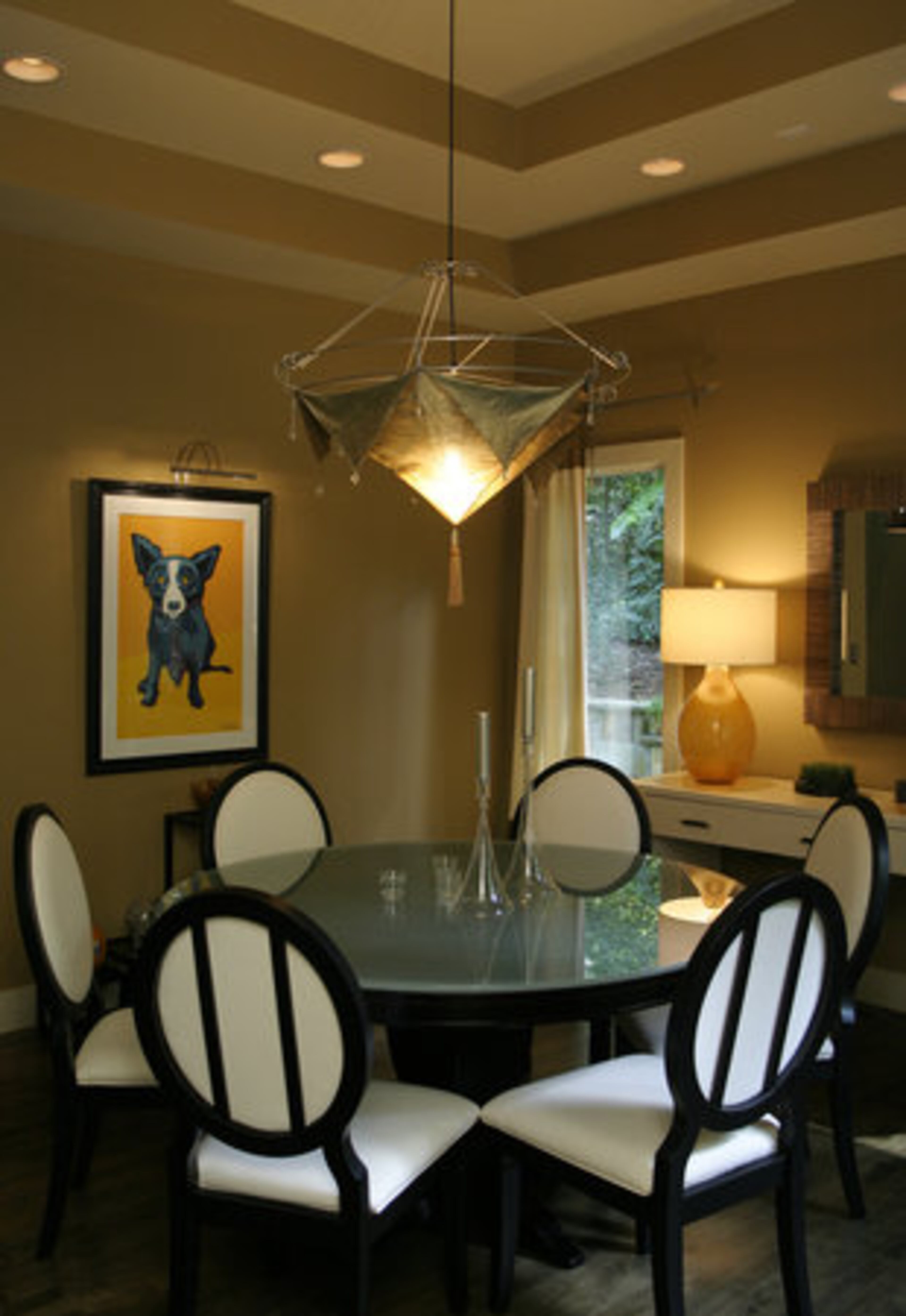 The couple loves their Blue Dog lithograph, signed by artist George Rodrigue, in the dining room.