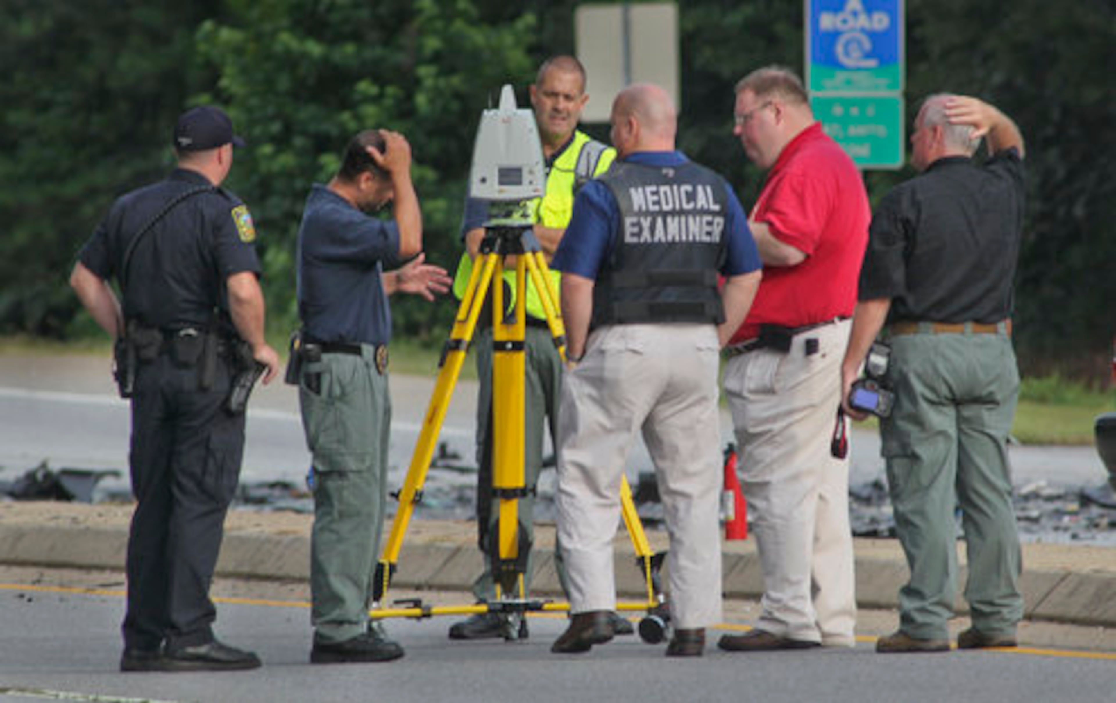 Police investigate the accident scene. Lawrenceville police Sgt. Christopher Ralston said witness statements and evidence at the scene suggested that the female driver of a Volvo that was eastbound on Old Norcross Road crossed the median and struck an oncoming Hyundai head-on.