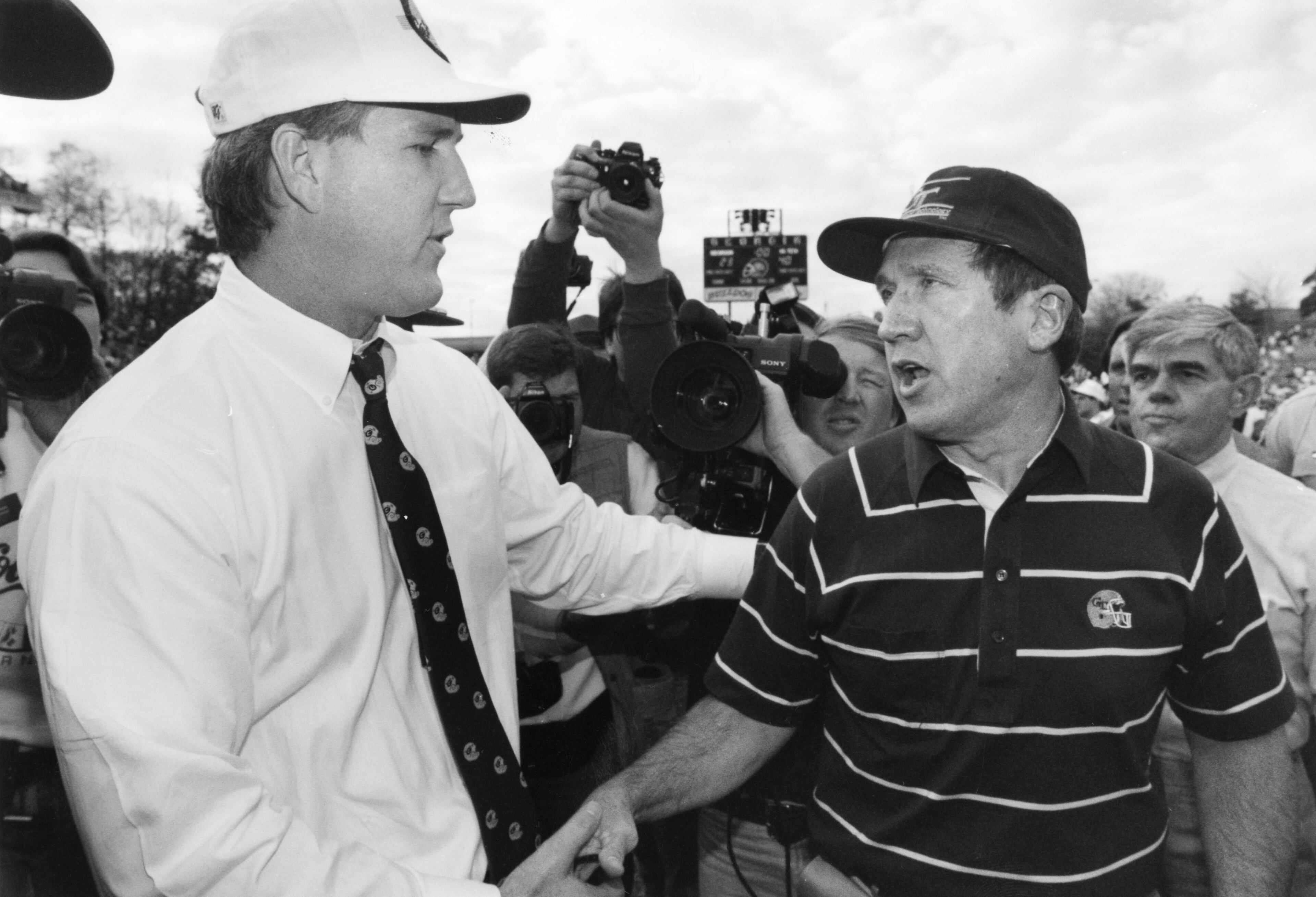Bobby Ross (right) shakes hands with Georgia's Ray Goff after Tech beat Georgia in 1990. Michael A. Schwarz / AJC